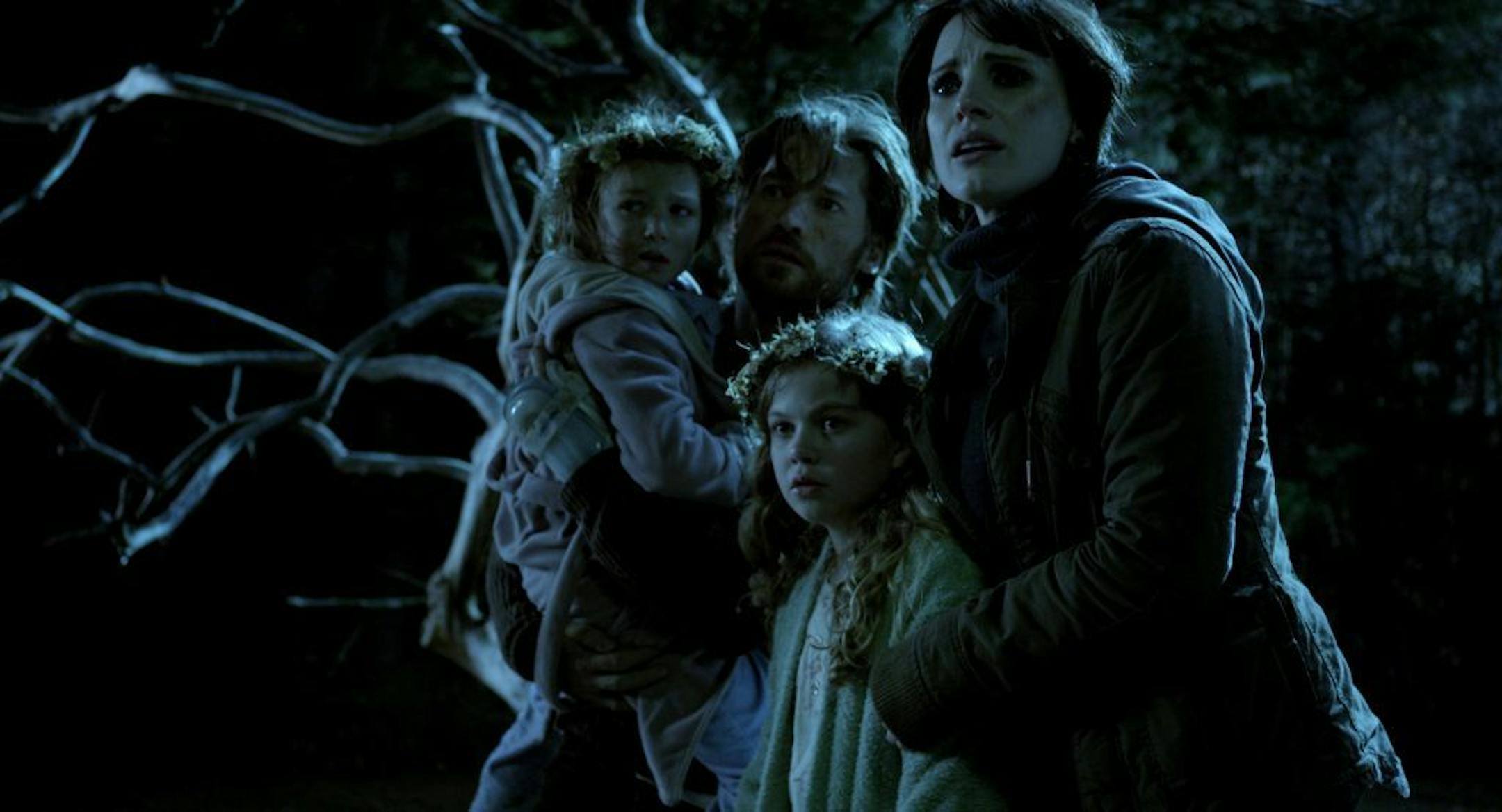 From left, Isabelle Nélisse, Nikolaj Coster-Waldau, Megan Charpentier and Jessica Chastain in a scene from "Mama."