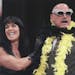 FILE -- Chyna places a feather boa on then-Gov. Jesse Ventura, during a press conference July 14, 1999 at the Target Center in Minneapolis to announce