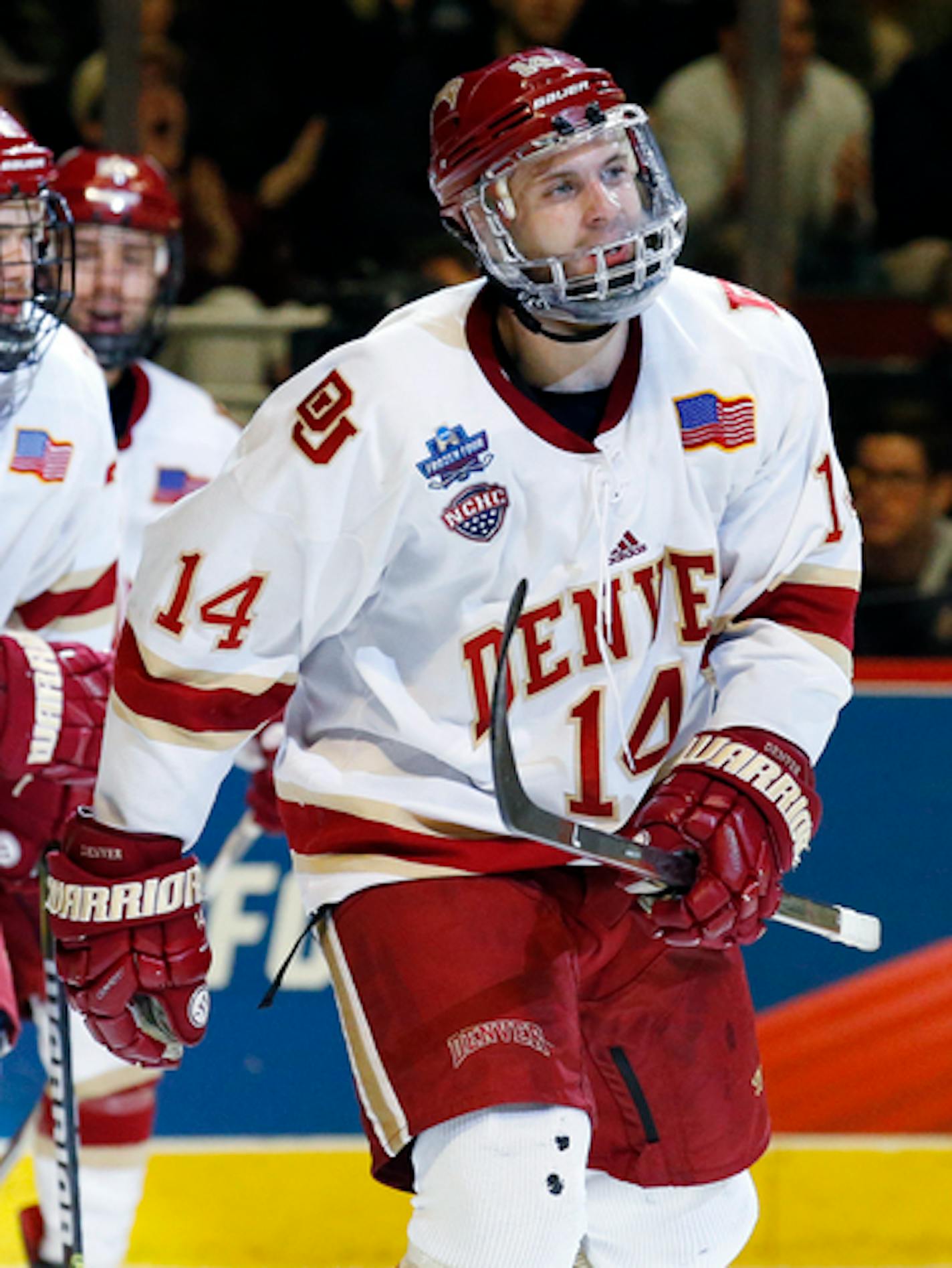 Denver left wing Jarid Lukosevicius (14) skates to the bench after scoring his goal against Minnesota-Duluth during the second period of an NCAA Frozen Four championship college hockey game, Saturday, April 8, 2017, in Chicago. (AP Photo/Nam Y. Huh)