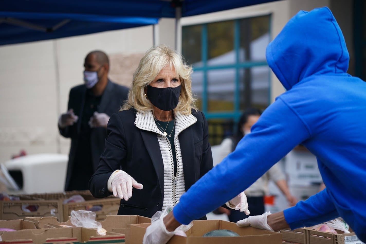 Dr. Jill Biden helped pack fresh produce outside the Sanneh Foundation headquarters in St. Paul, where food was given to families in need at a drive-through event on Saturday, Oct. 3, 2020.