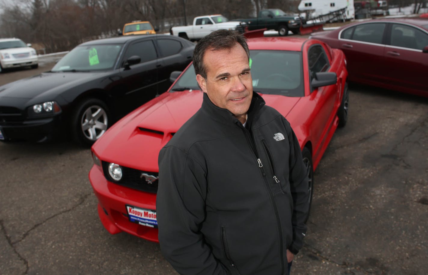 Dan Koppy, of Koppy Motors of Forest Lake, on his lot. Poppy said that he was not for being open on Sundays so that his employees could spend time with their families. ] (KYNDELL HARKNESS/STAR TRIBUNE) kyndell.harkness@startribune.com At Koppy Motors in Forest Lake Min., Wednesday, January 28, 2015.