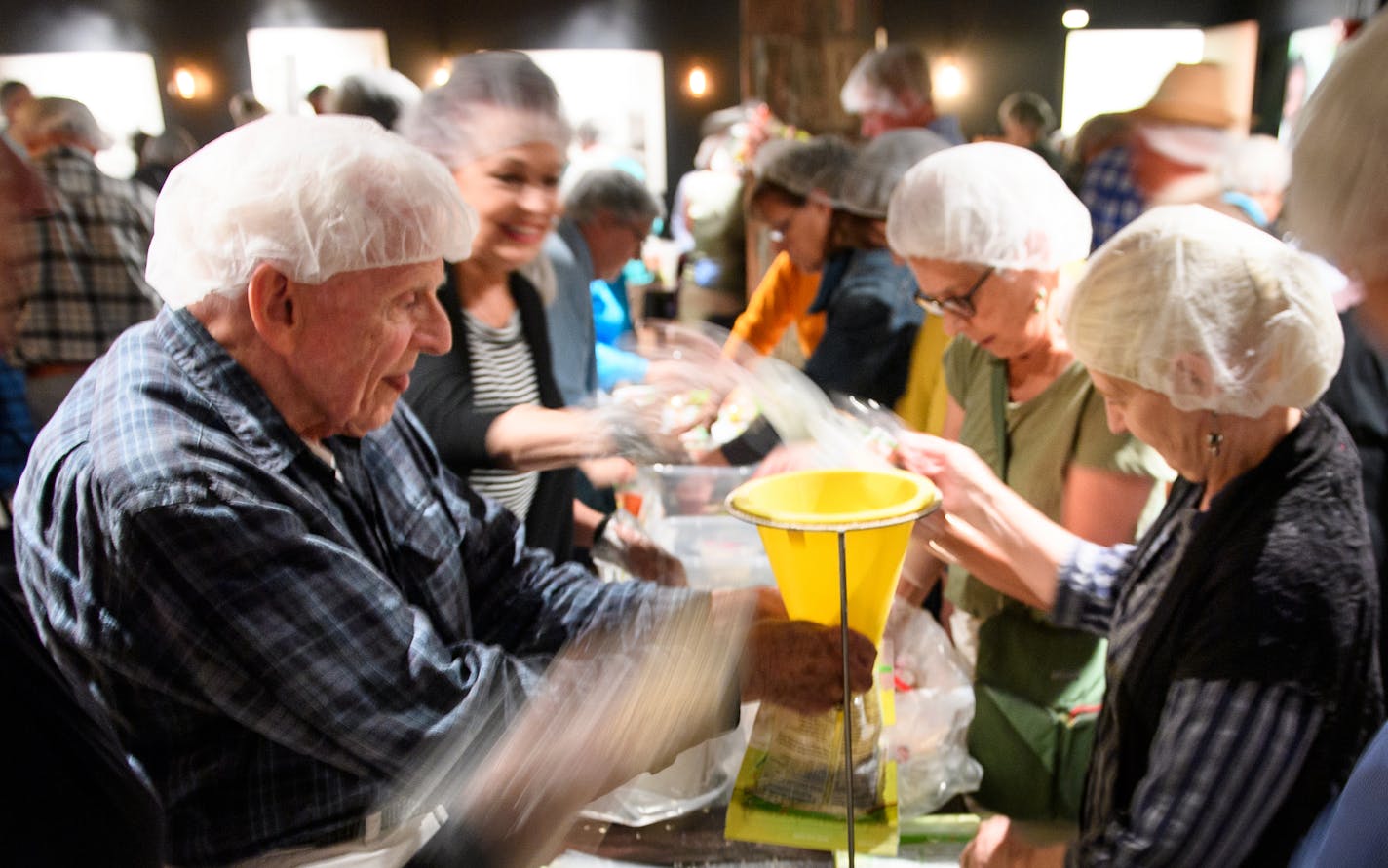 Volunteers packed 15,000 bags of instant oatmeal for Houston food shelves Tuesday afternoon at Vieux Carre in St. Paul. ] AARON LAVINSKY &#xef; aaron.lavinsky@startribune.com Volunteers and staff from Minnesota relief agencies are part of the second wave of help now making their way to Houston to relieve exhausted workers from southern states. Nearly 60 Red Cross relief workers and a dozen volunteers from the Salvation Army are on the ground in Texas. Minnesota volunteers from both agencies are