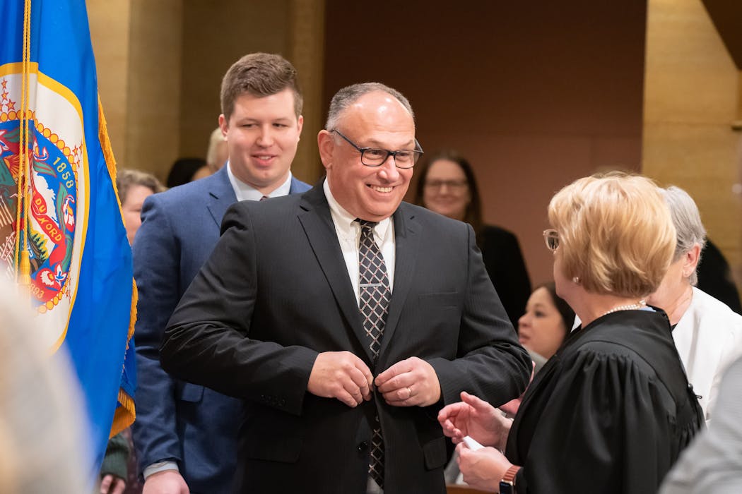 Sen. Rob Kupec, DFL-Moorhead, introduced himself to Minnesota Supreme Court Chief Justice Lorie Skjerven Gildea during his family portrait and mock swearing-in on Tuesday, Jan. 3, 2023.