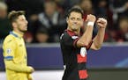 Leverkusen&#xed;s Javier Hernandez of Mexico celebrates after scoring his first goal during the Champions League group E soccer match between Bayer Le