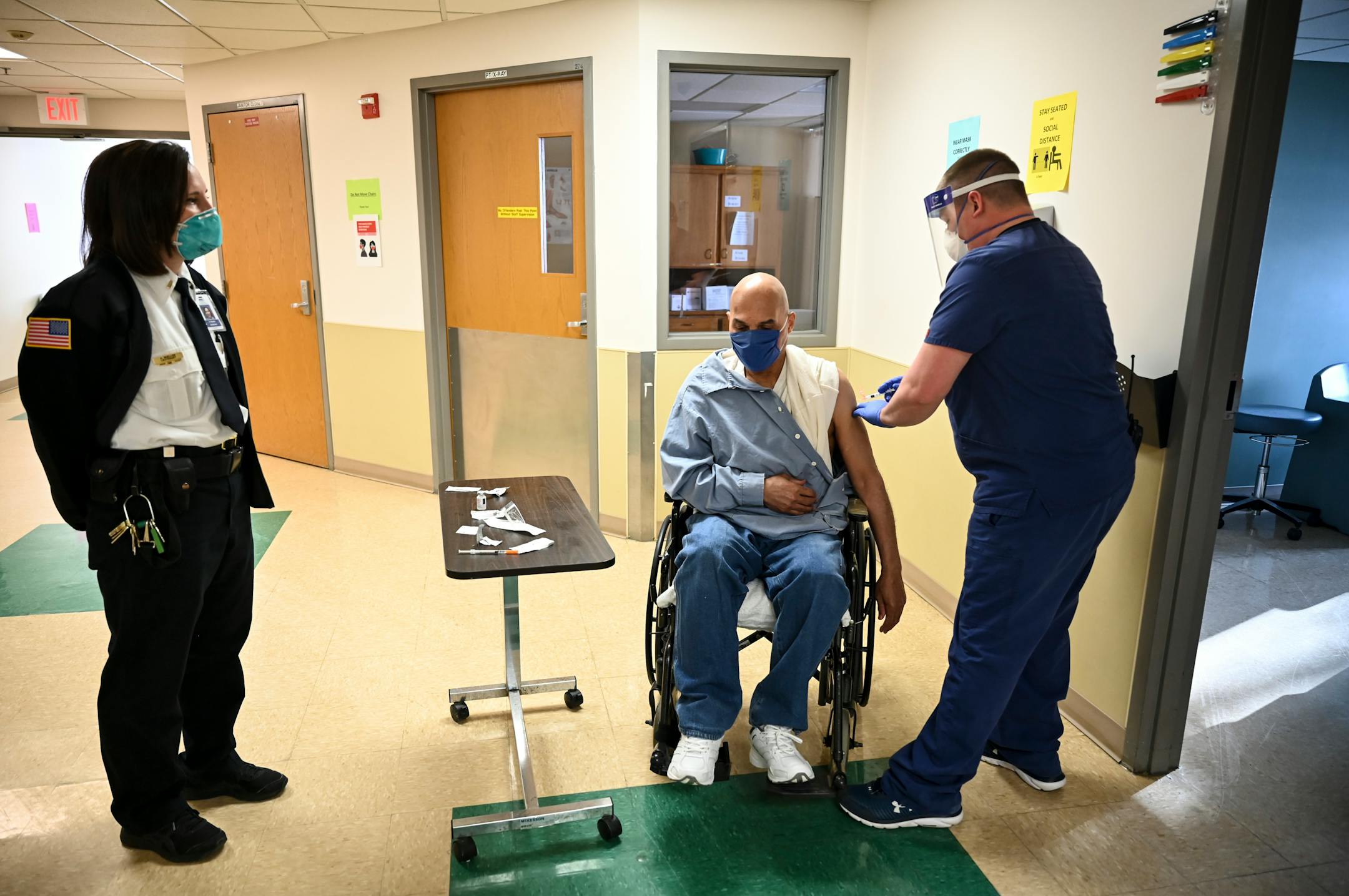 Inmate Emmett Thomas, 68, received a COVID-19 vaccination Monday morning from RN supervisor Kelly Markham in Faribault Prison's Linden Unit, which houses medically vulnerable inmates.Thomas has a central nervous disorder.