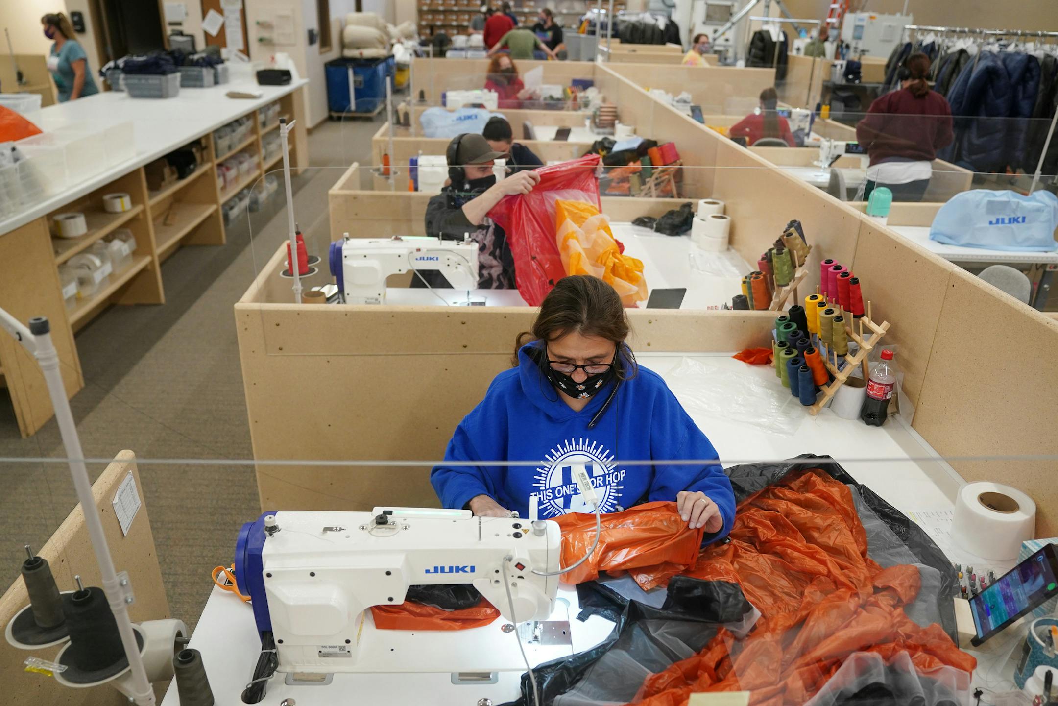 Sewer Natalie Armstrong stitched a custom sleeping quilt at her workstation Thursday. ] ANTHONY SOUFFLE • anthony.souffle@startribune.com Sewers at Enlightened Equipment worked to create custom quilts, a trending alternative to the traditional mummy sleeping bag design, for outdoor enthusiasts Thursday, Nov. 12, 2020 from their headquarters in downtown Winona, Minn.