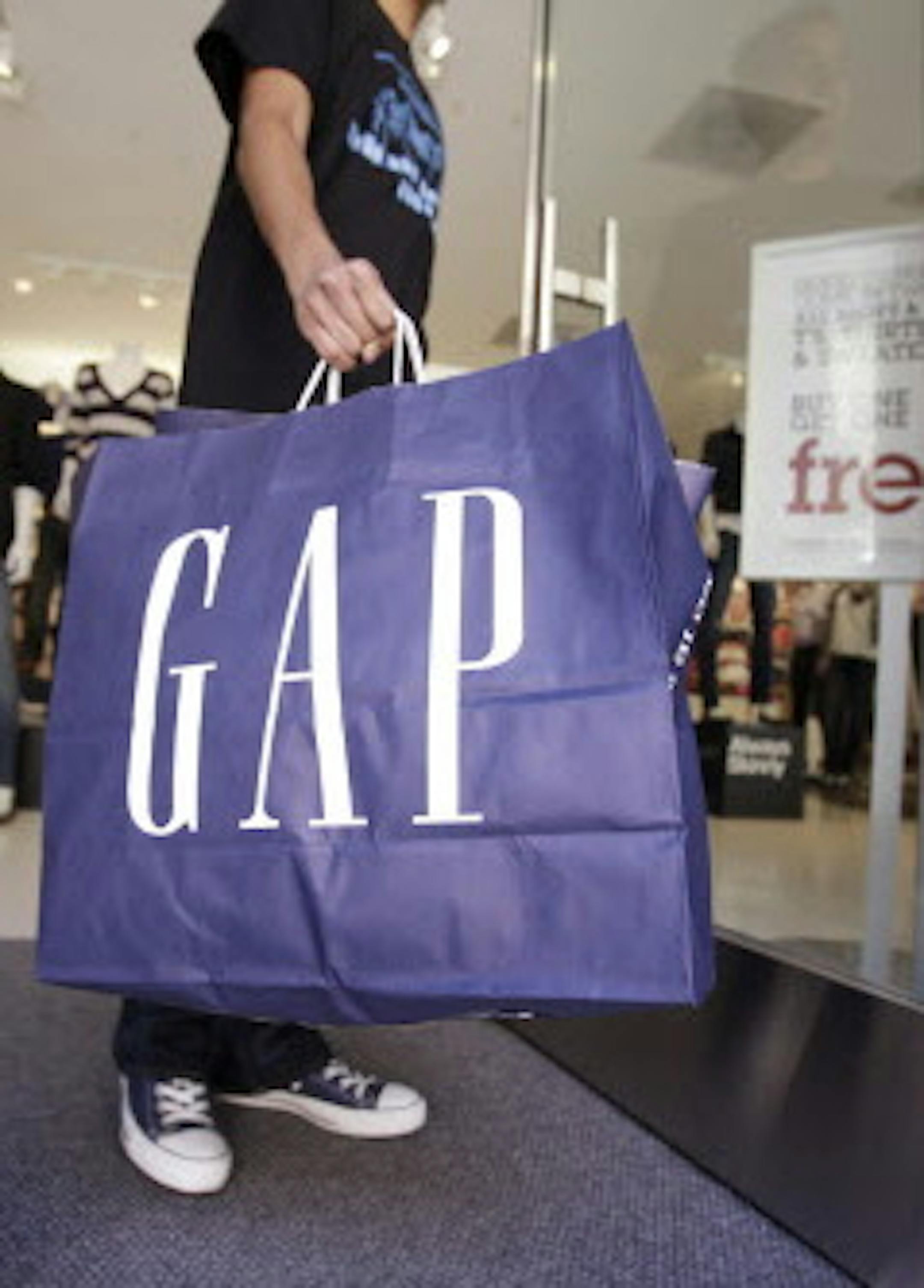 FILE - In this Aug. 19, 2009 file photo, a shopper leaves a Gap store in Palo Alto, Calif. Gap Inc. releases quarterly financial results Thursday, Nov. 18, 2010, after the market close. (AP Photo/Paul Sakuma, File)