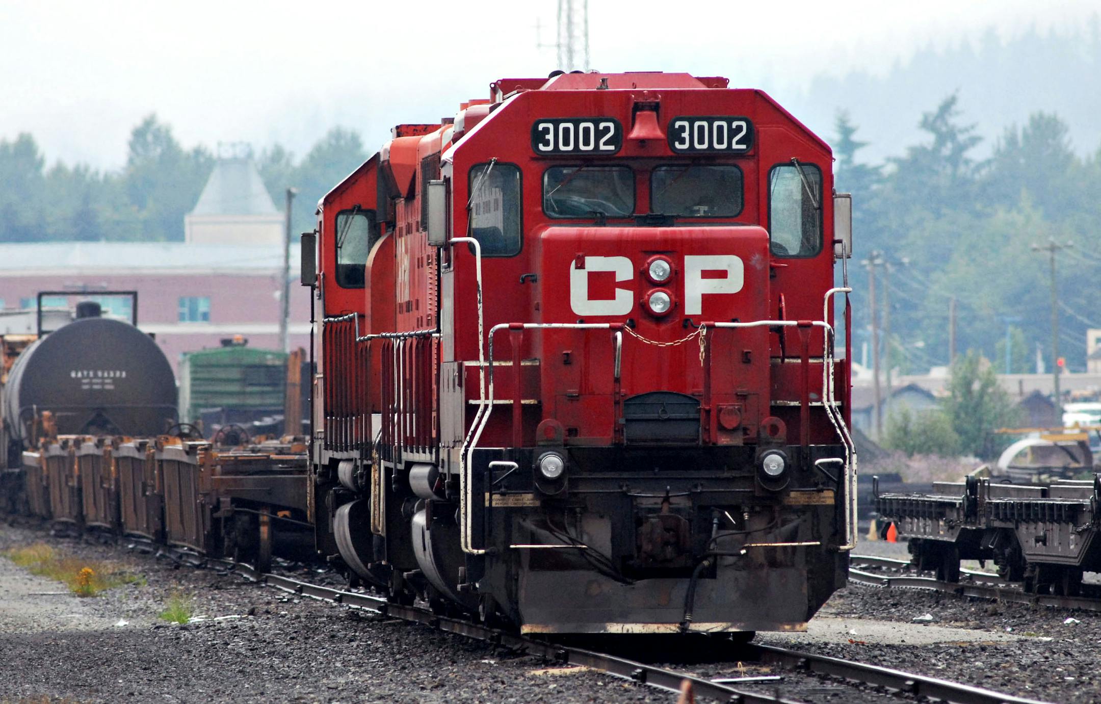 A Canadian Pacific Railway engine sits in a railyard in Port Coquitlam, British Columbia, Canada, Wednesday, July 18, 2007. Canadian Pacific Railway Ltd., the country's second-largest railroad, said it will acquire Dakota, Minnesota & Eastern Railroad Corp. for $1.48 billion in cash to expand in the U.S. Midwest. Photographer: Don MacKinnon/Bloomberg News