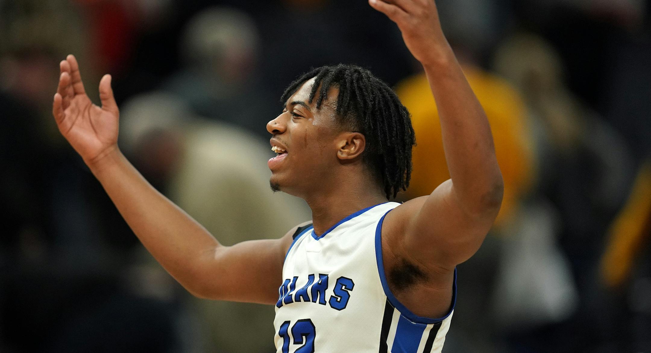 Minneapolis North guard Nasir El-Amin (12) celebrated the win with his student section at the end of the second half. ] ANTHONY SOUFFLE • anthony.souffle@startribune.com Minneapolis North Community High School played Perham High School in an MSHSL Class 2A boys' semifinal basketball game Friday, March 22, 2019 at the Target Center in Minneapolis.