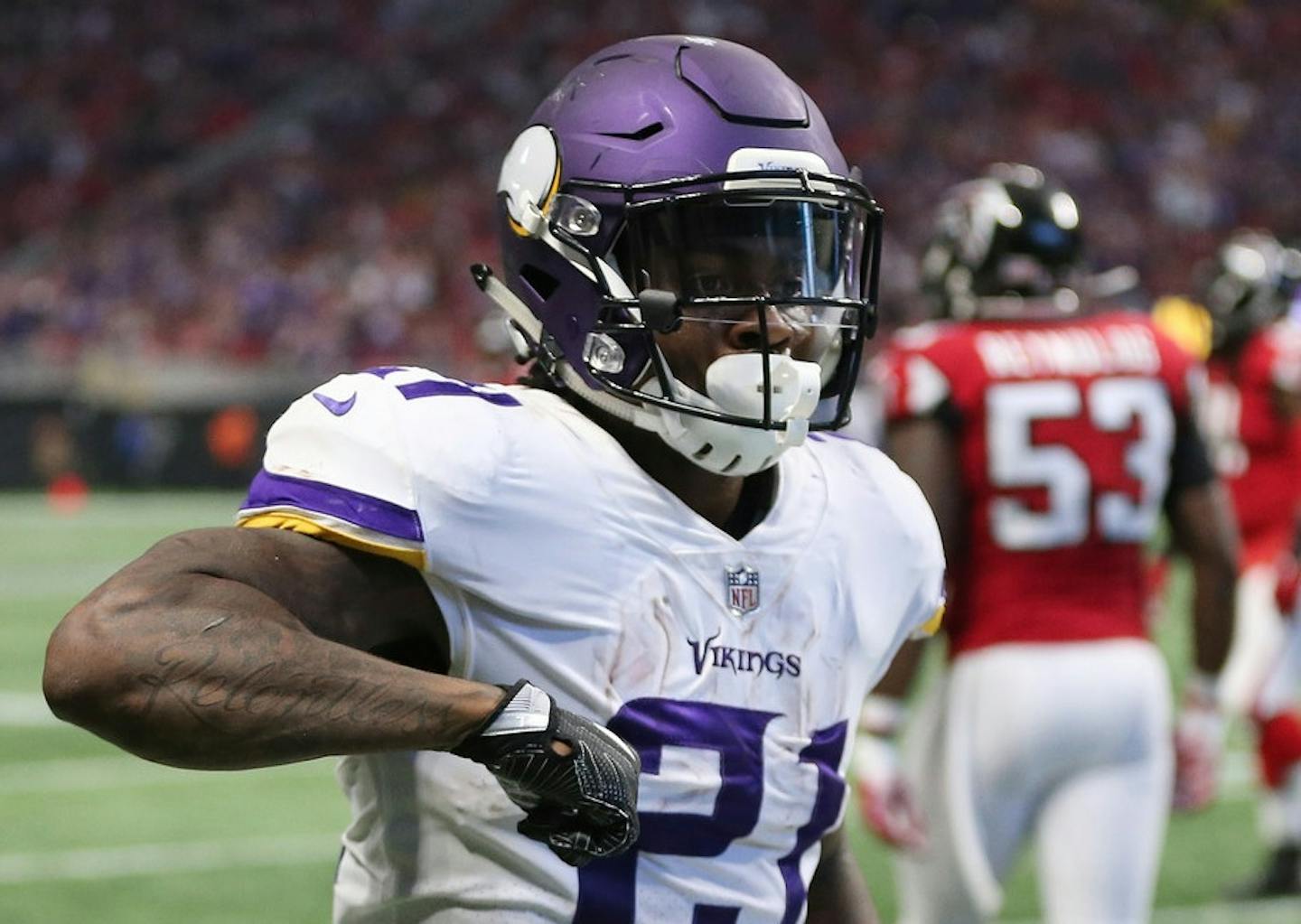 Minnesota Vikings running back Jerick McKinnon (21) celebrates his touchdown against the Atlanta Falcons by doing the "Dirty Bird."