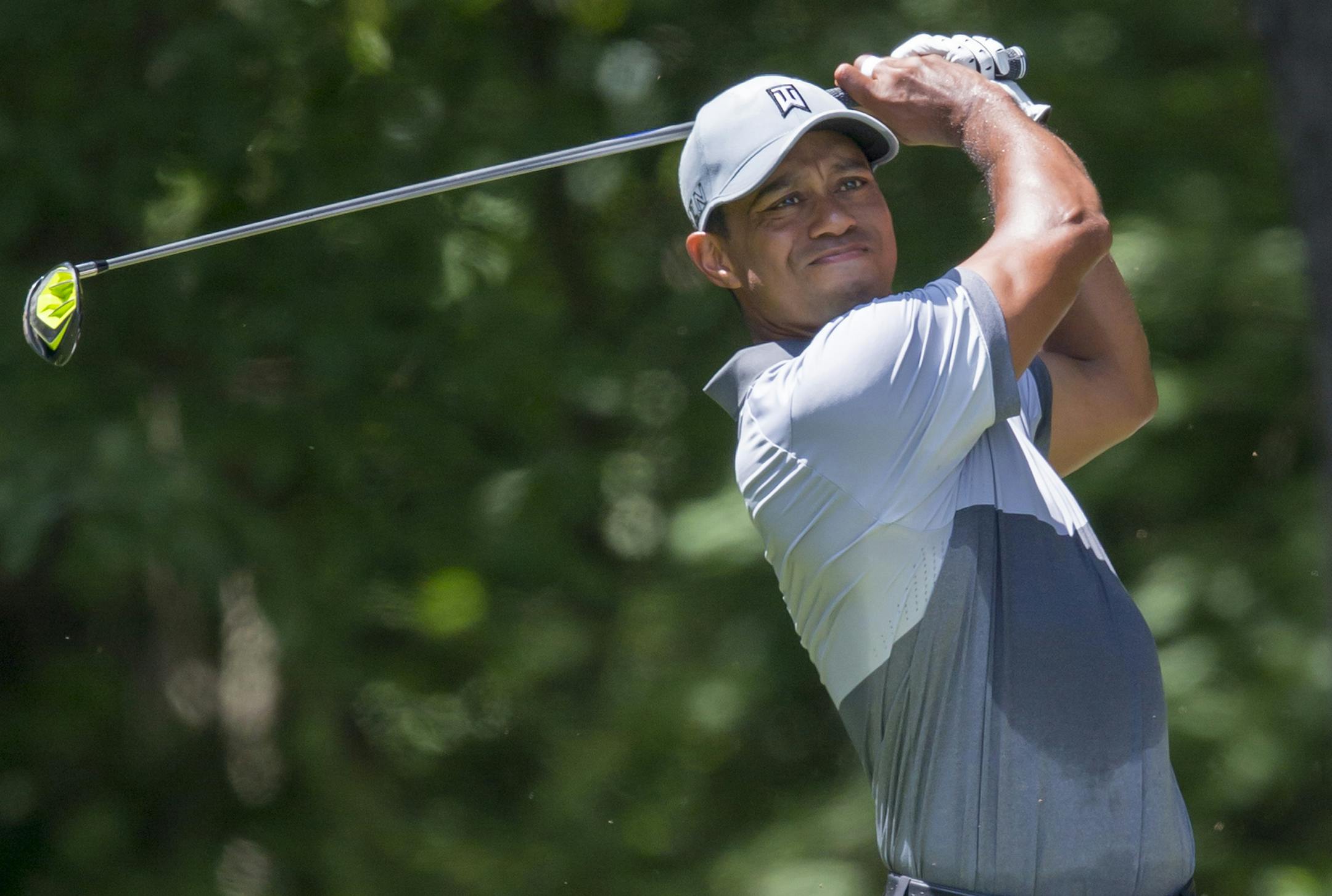 Tiger Woods tees off on the second hole during the third round of the Wyndham Championship golf tournament at Sedgefield Country Club in Greensboro, N.C., Saturday, Aug. 22, 2015. (AP Photo/Rob Brown)
