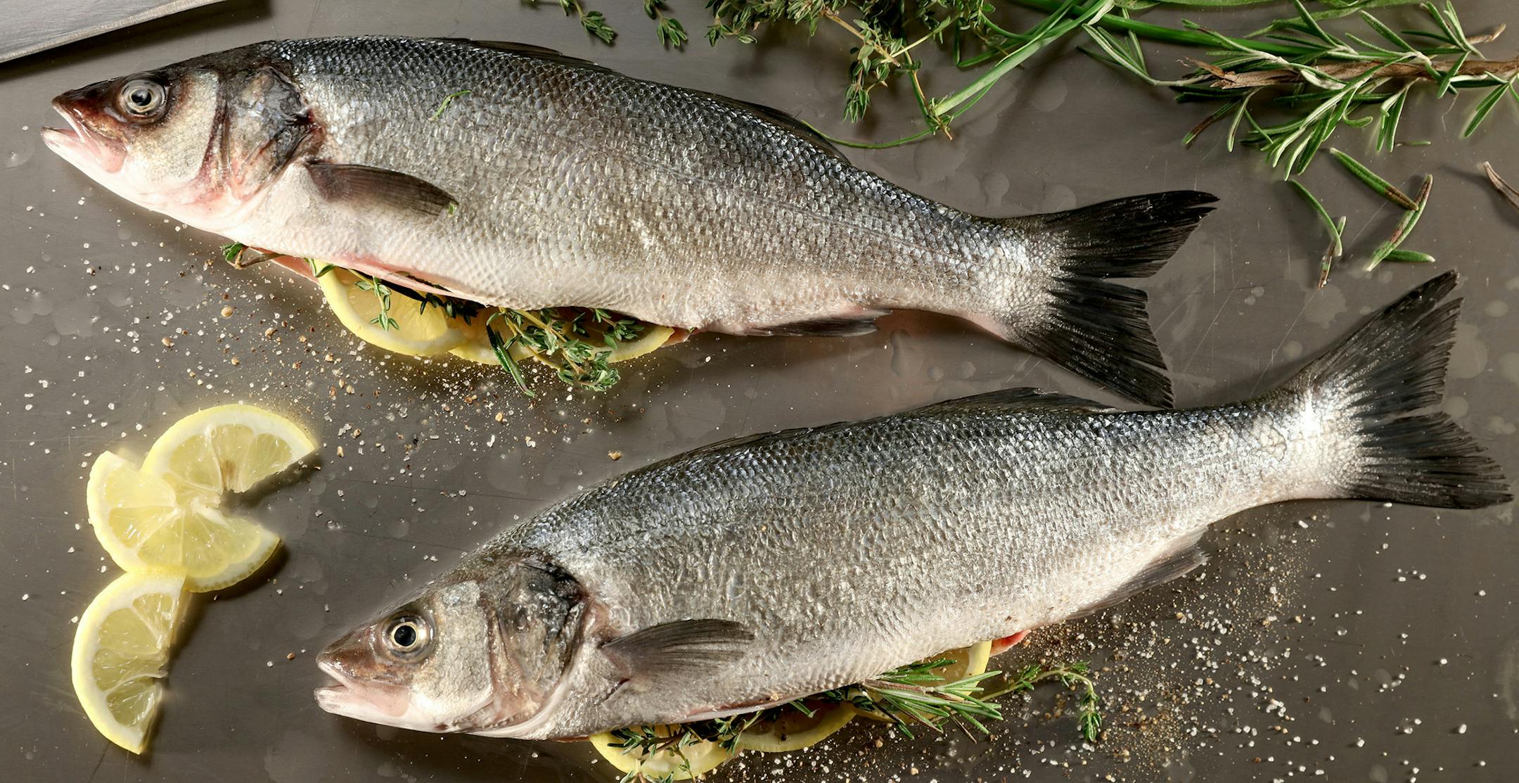 Whole sea bass can work well on the grill. Season the fish inside and out with salt and pepper or a good seafood rub. If you like, stuff the cavities with fresh herbs. (Michael Tercha/Chicago Tribune/TNS) ORG XMIT: 1185286
