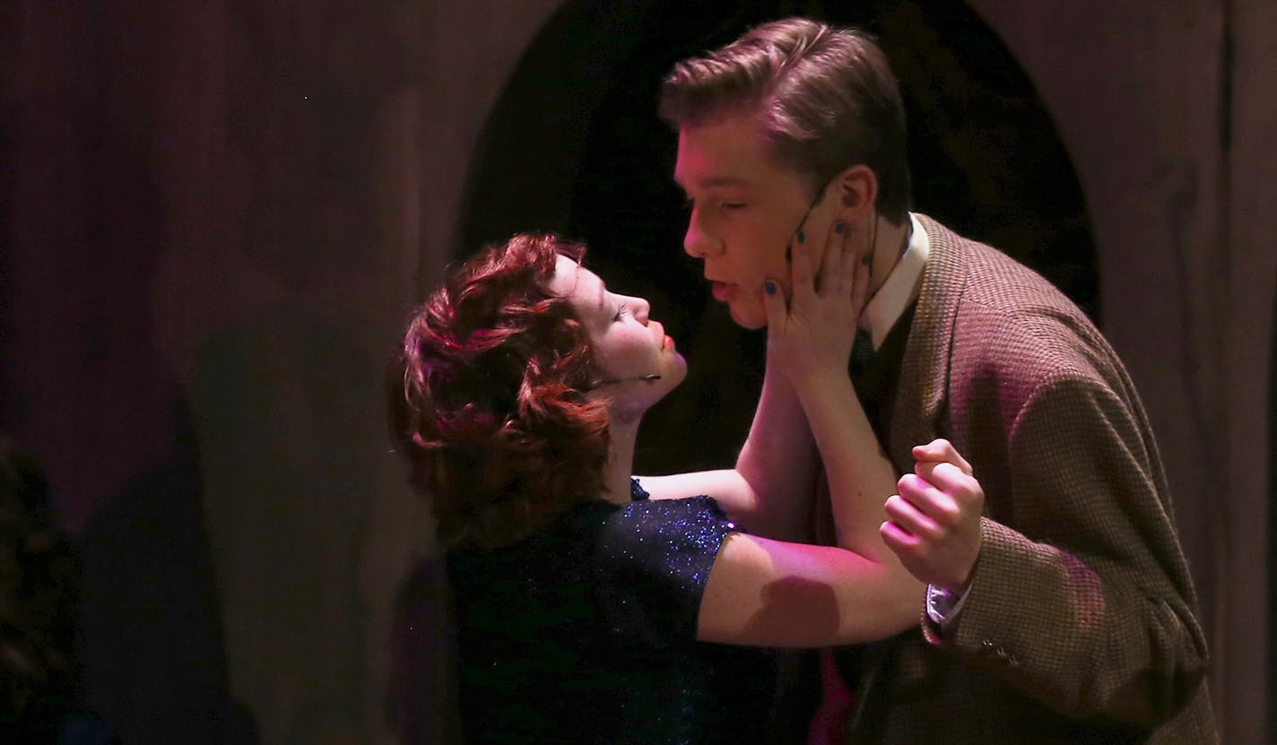 Seniors Madisen Dempsey, playing Sally Bowles and Nick Ludgate, playing Clifford Bradshaw prepare to kiss during dress rehearsal. ] (KYNDELL HARKNESS/STAR TRIBUNE) kyndell.harkness@startribune.com During rehearsal of Cabaret at the Spring Lake Park High School in Spring Lake Park April 2014.