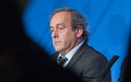 UEFA President Michel Platini attends a press conference to mark the one year to go before the start of EURO 2016 soccer tournament in Paris, Wednesda