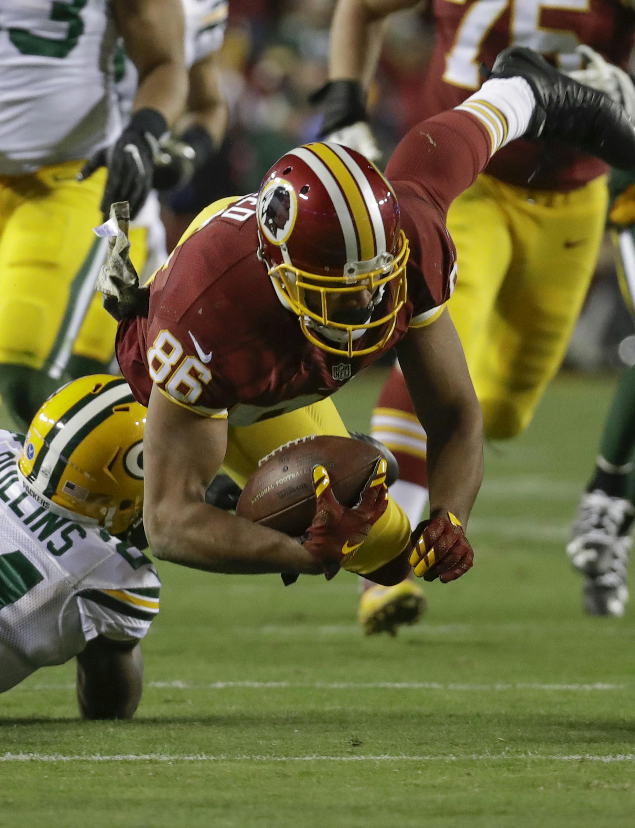 Washington Redskins tight end Jordan Reed (86) is knocked off his feet by Green Bay Packers cornerback Quinten Rollins (24) during the first half of an NFL football game in Landover, Md., Sunday, Nov. 20, 2016. (AP Photo/Patrick Semansky)