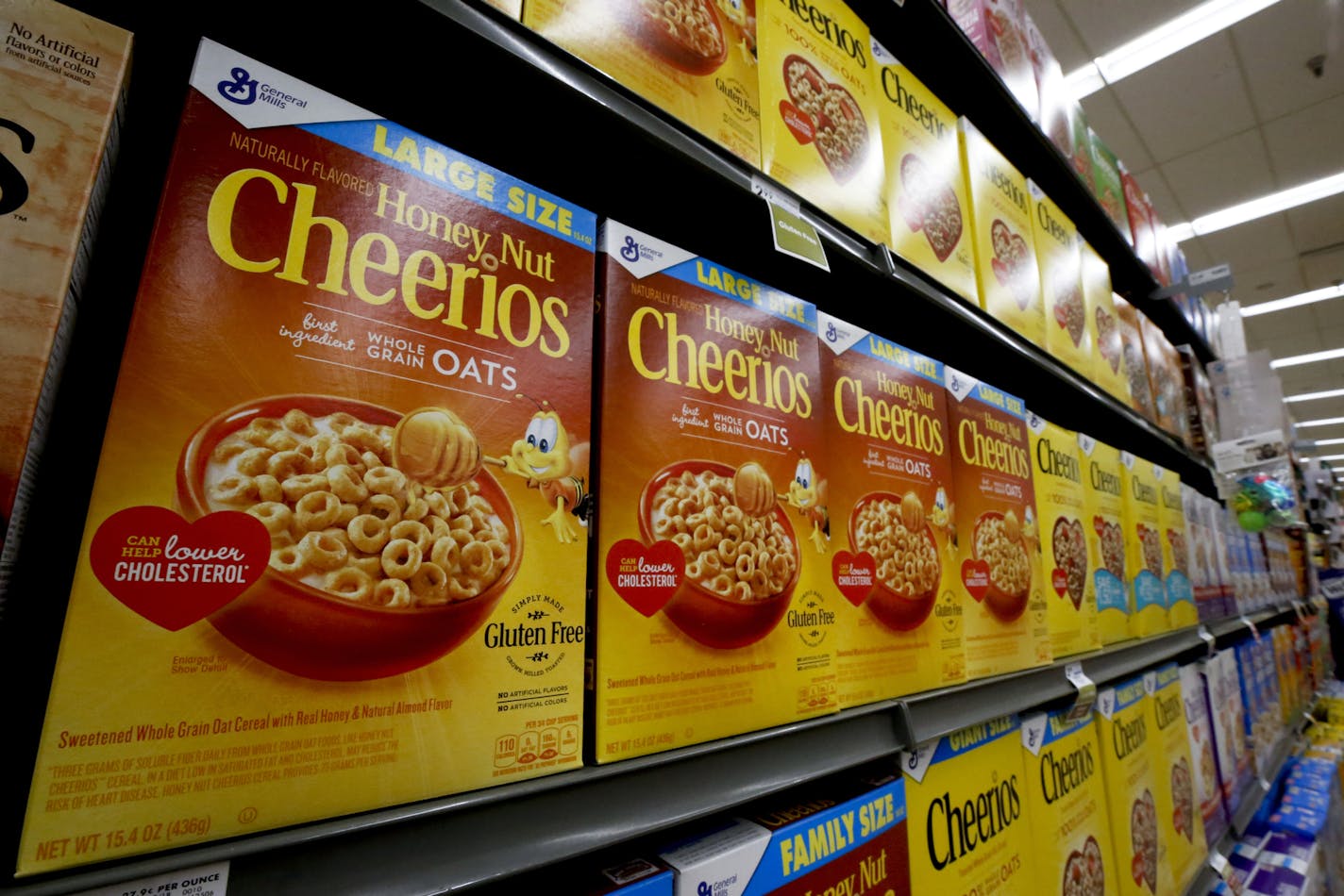 FILE- In this Aug. 8, 2018, file photo boxes of General Mills Honey Nut Cheerios cereal sit on display in a market in Pittsburgh. General Mills Inc. reports financial results Wednesday, March 20, 2019. (AP Photo/Gene J. Puskar, File) ORG XMIT: MER08baedb2d477ca8b220c81a6c75ac