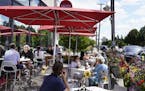 The outdoor lunch crowd at Yum! Kitchen and Bakery Wednesday in St. Louis Park.] DAVID JOLES • david.joles@startribune.com outdoor dining spots for 