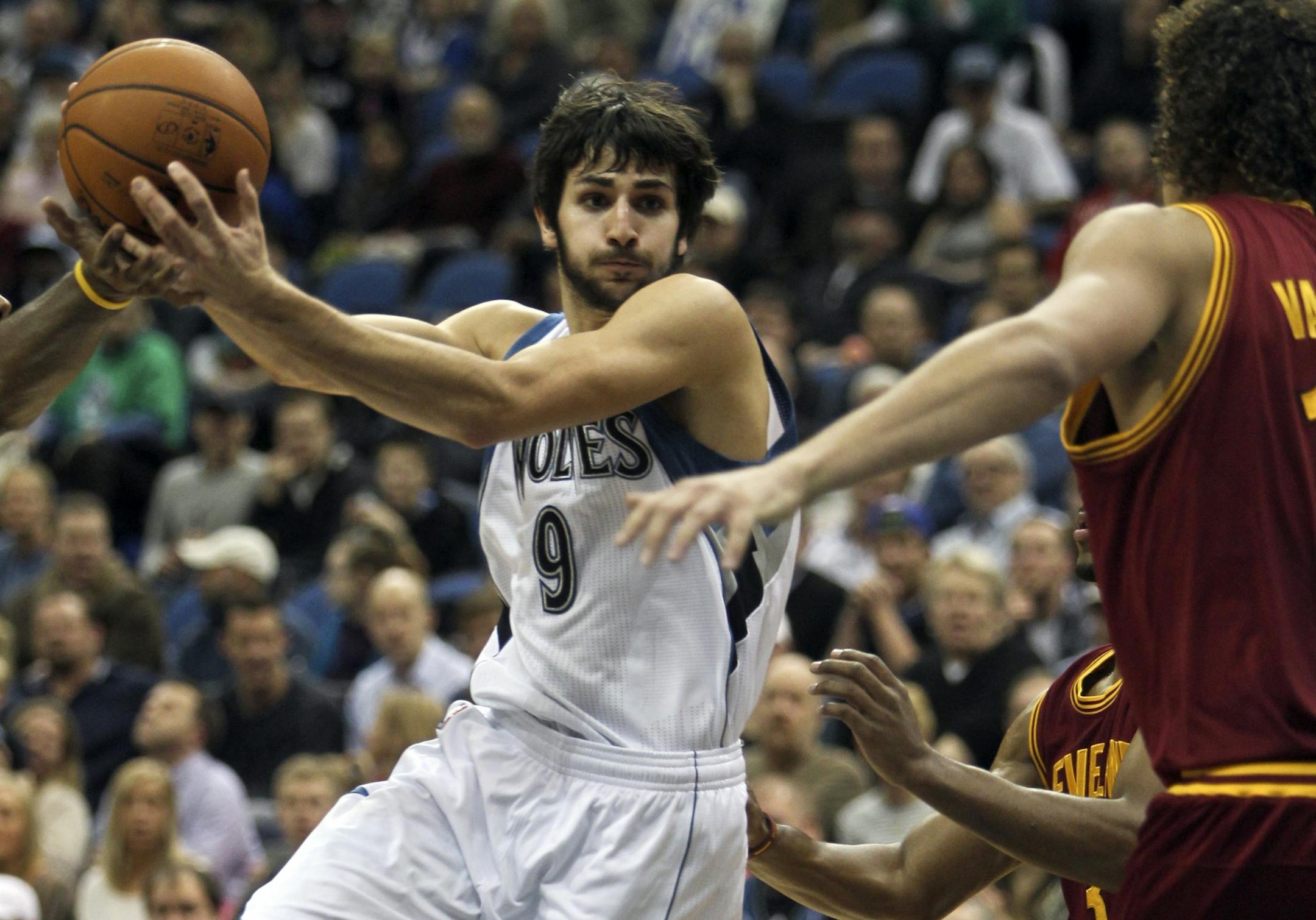 The Minnesota Timberwolves Ricky Rubio (9) has the ball swated away while driving against the Cleveland Cavaliers Anderson Varejao during second quarter action Friday, Jan. 6, 2012 in Minneapolis, MN.