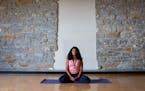 Serita Colette, who leads yoga workshops for women of color, demonstrated the calming Sukhasana pose.