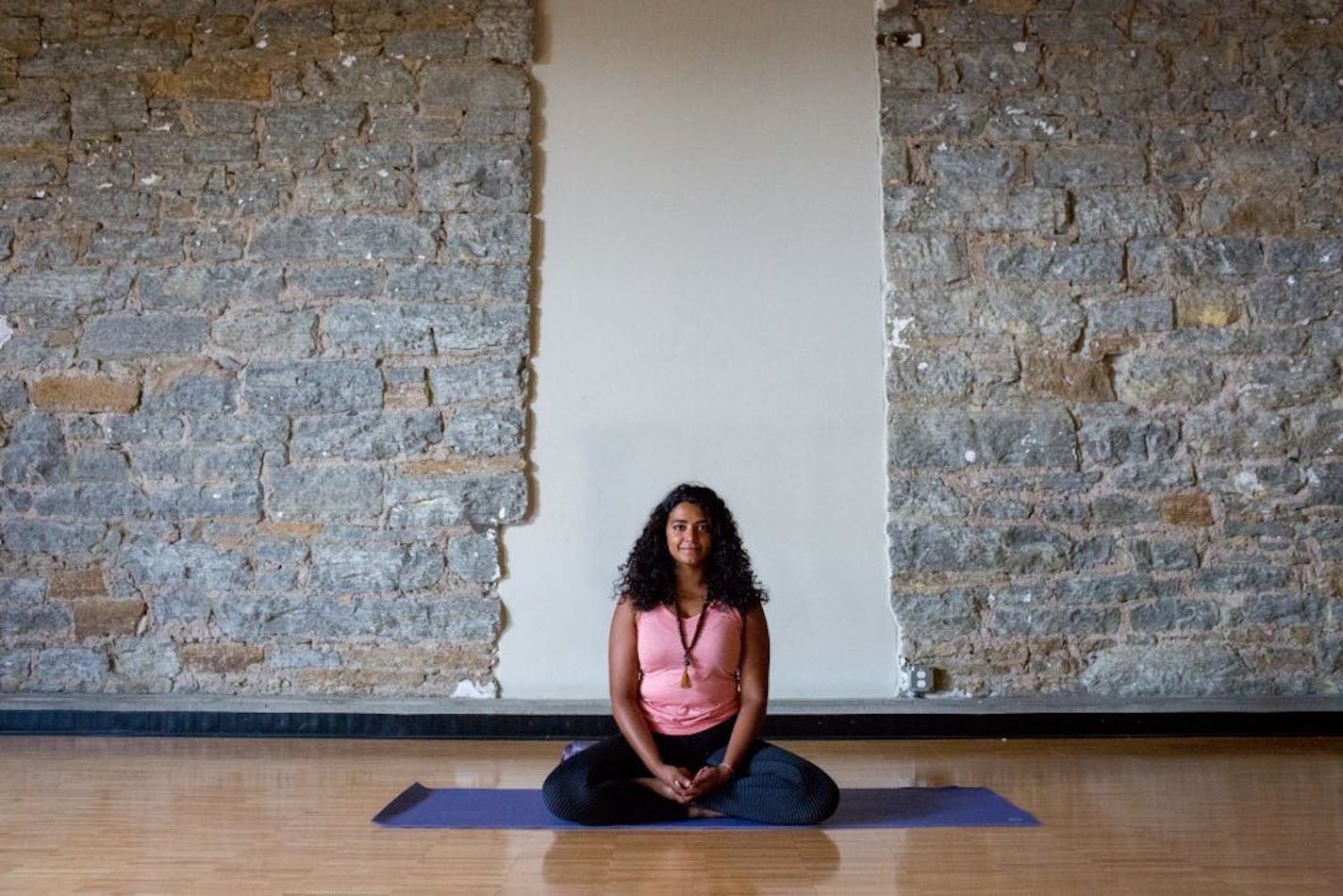 Serita Colette, who leads yoga workshops for women of color, demonstrated the calming Sukhasana pose.