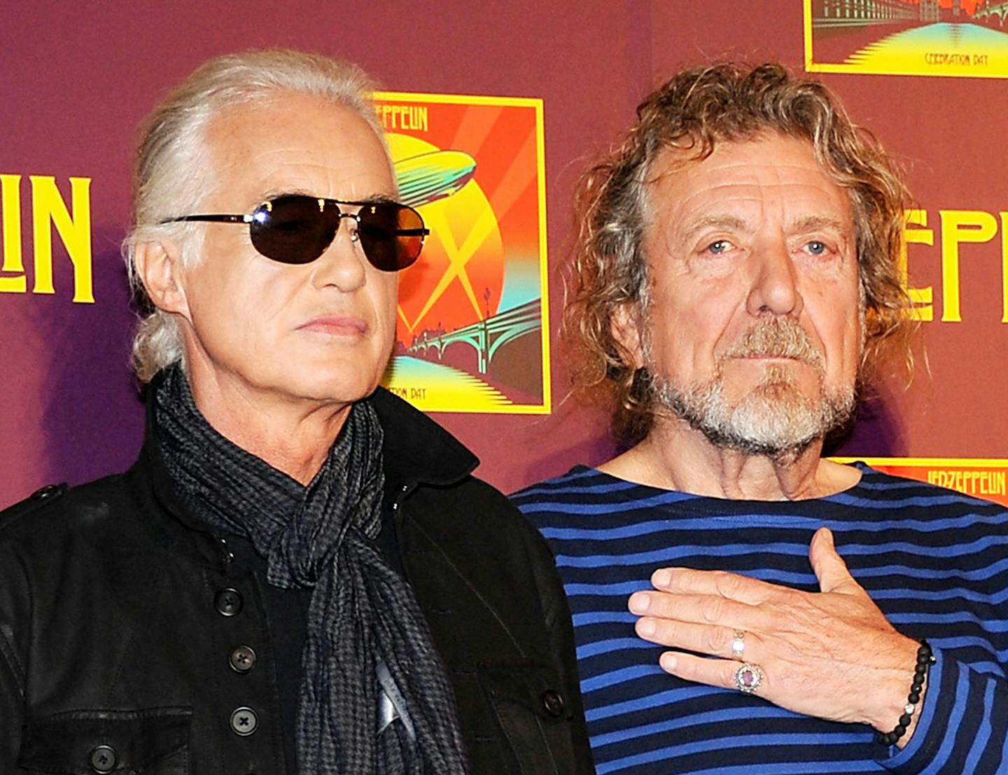 FILE - In this Oct. 9, 2012 file photo, members of Led Zeppelin, guitarist Jimmy Page, left, and singer Robert Plant appear at a press conference ahead of the worldwide theatrical release of "Celebration Day", a concert film of their 2007 London O2 arena reunion show, in New York. A federal judge in Los Angeles ruled Friday, April 8, 2016, that a copyright infringement lawsuit over the Led Zeppelin song "Stairway to Heaven" should be decided at trial. A trustee of late songwriter-guitarist Randy