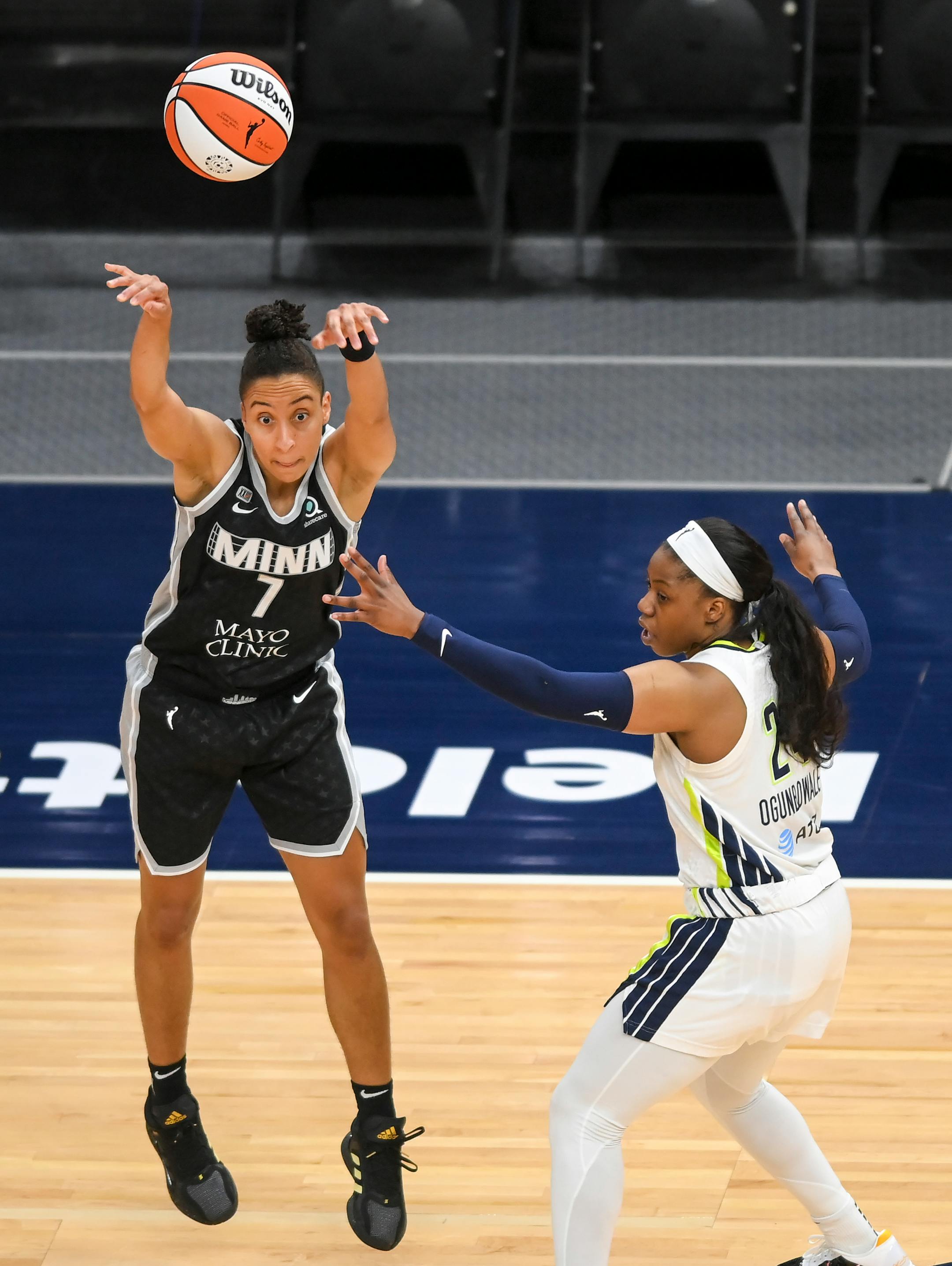 Minnesota Lynx guard Layshia Clarendon passed the ball as she was defended by Dallas Wings guard Arike Ogunbowale (24) in the first half.