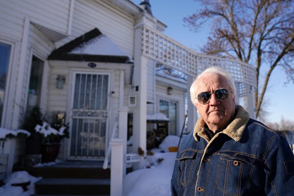 Dick Kelly stood for a portrait as he showed off the security cameras, including a ring doorbell camera, he has positioned around his home Thursday. ]