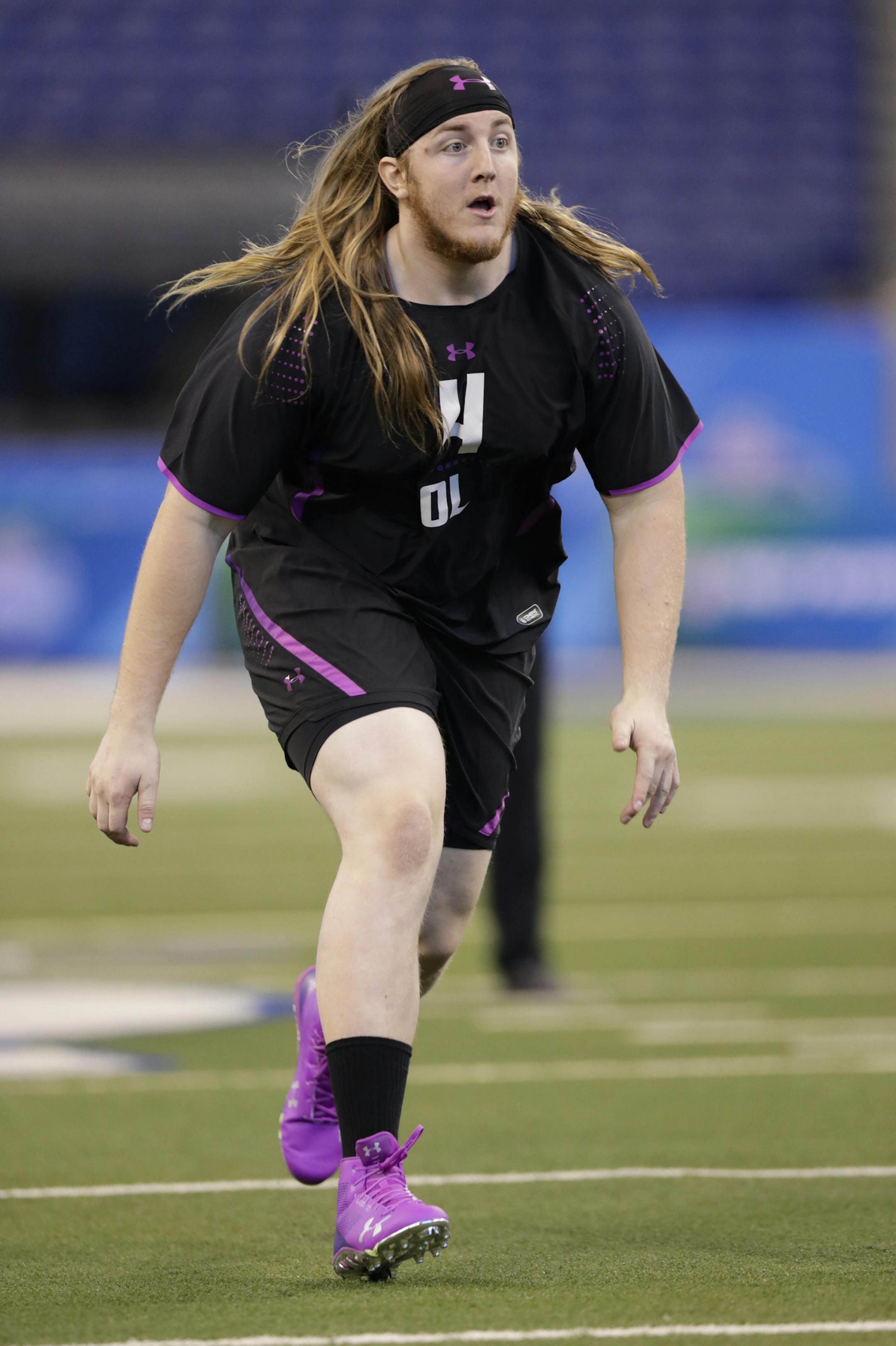 Humboldt State offensive lineman Alex Cappa runs a drill at the NFL football scouting combine in Indianapolis, Friday, March 2, 2018. (AP Photo/Michael Conroy) ORG XMIT: INMC10
