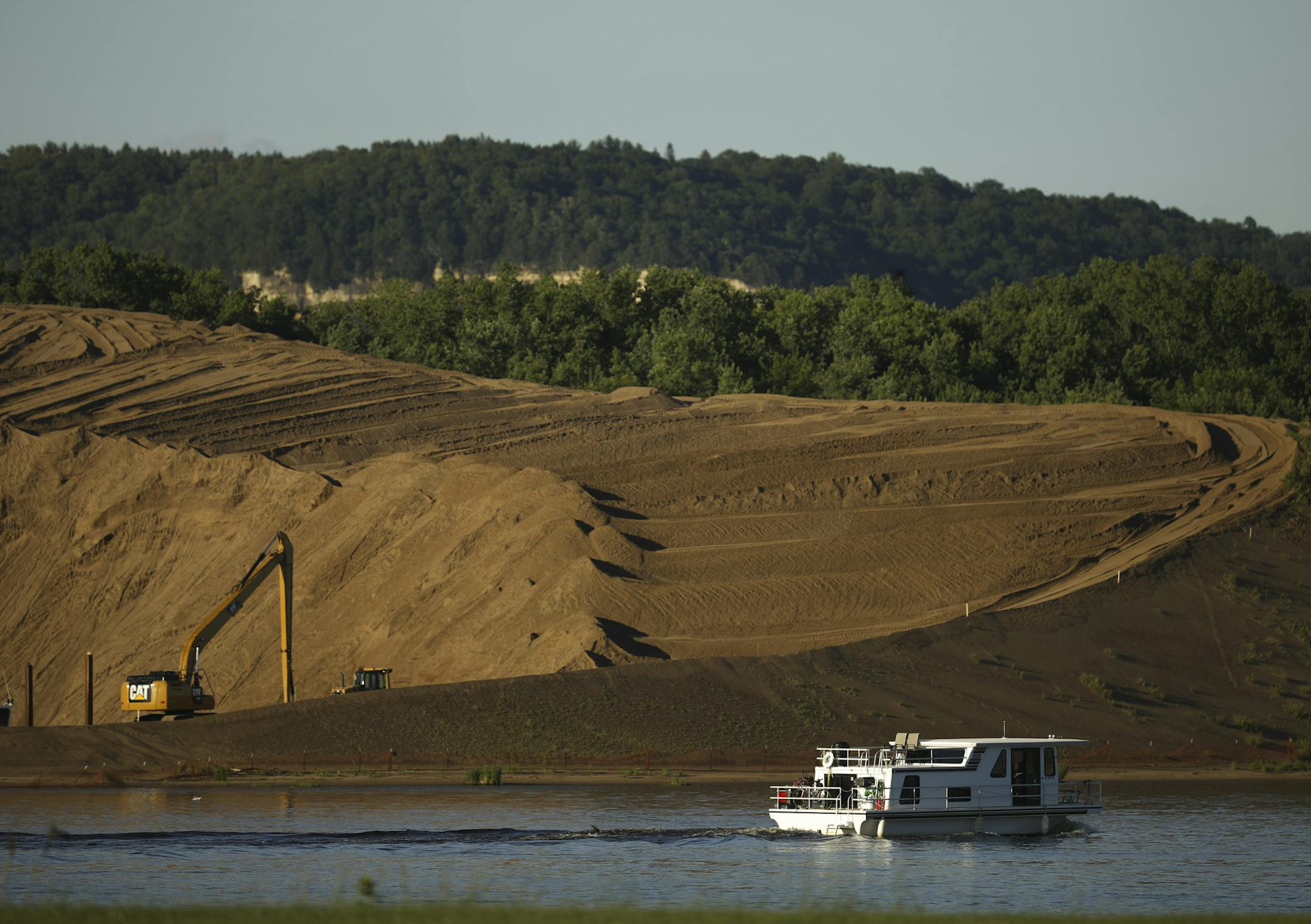 Sand dredged from the Mississippi River is piled high not far from Willard Drysdale's farm. ] JEFF WHEELER ï jeff.wheeler@startribune.com Willard Drysdale learned last month that the U.S. Army Corps of Engineers has chosen his farm as the best site to dump 7 million cubic yards of sand dredged from the Mississippi River over the next 40 years. He hoped to pass the farm on to his daughter, Chelsea. They were photographed Tuesday evening, June 20, 2017 at their farm in rural Kellogg.