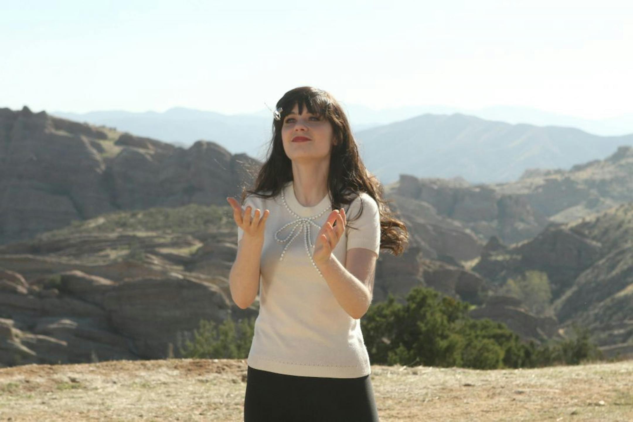 In this publicity photo released by FOX, Zooey Deschanel as Jess makes an unexpected trip to the desert in a scene from "New Girl." Deschanel was nominated for an Emmy award for outstanding lead actress in a comedy series Thursday, July 19, 2012 for her role in "New Girl." The 64th annual Primetime Emmy Awards will be presented Sept. 23 at the Nokia Theatre in Los Angeles, hosted by Jimmy Kimmel and airing live on ABC.
