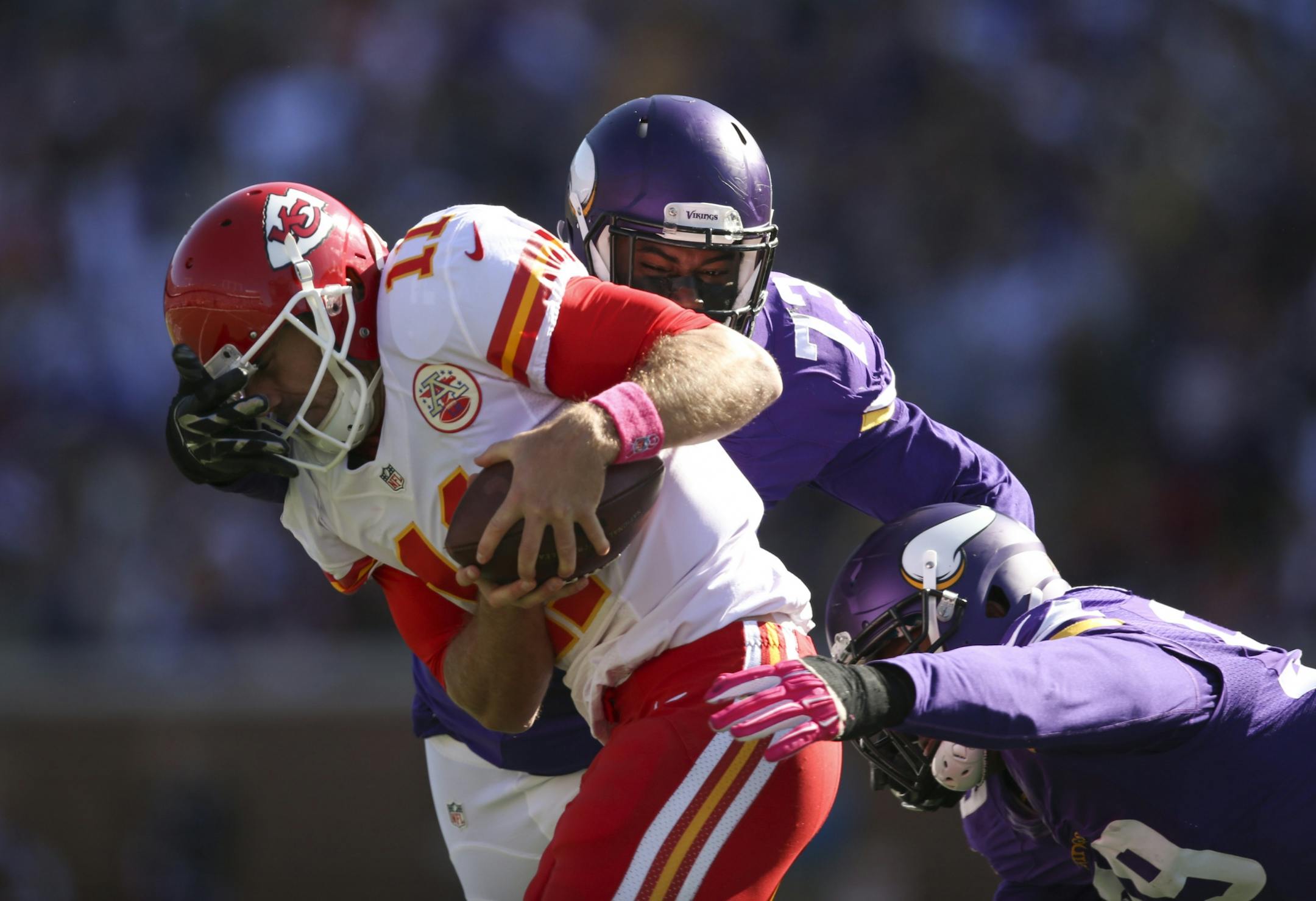 Vikings defensive tackle Sharrif Floyd (73) and Vikings defensive end Danielle Hunter (99) stopped Kansas City quarterback Alex Smith (11) after he scrambled for a three yard gain in the second quarter Sunday afternoon.