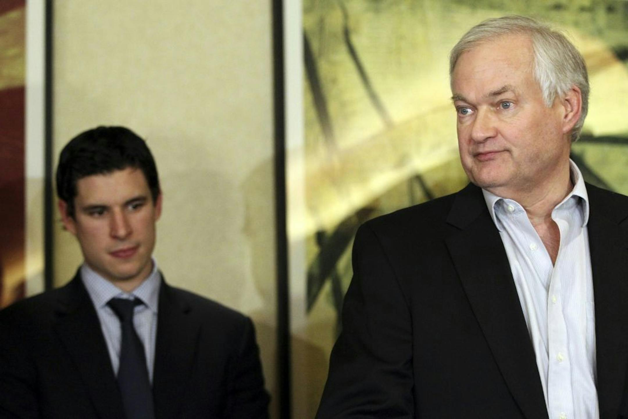 Pittsburgh Penguins' Sidney Crosby, left, listens as Don Fehr, executive director for the National Hockey League Players Associations, speaks to reporters on Thursday, Dec. 6, 2012, in New York. Talks in the NHL labor fight broke down after just one hour on Thursday night, and it is not known when the league and the players' association would get back together.