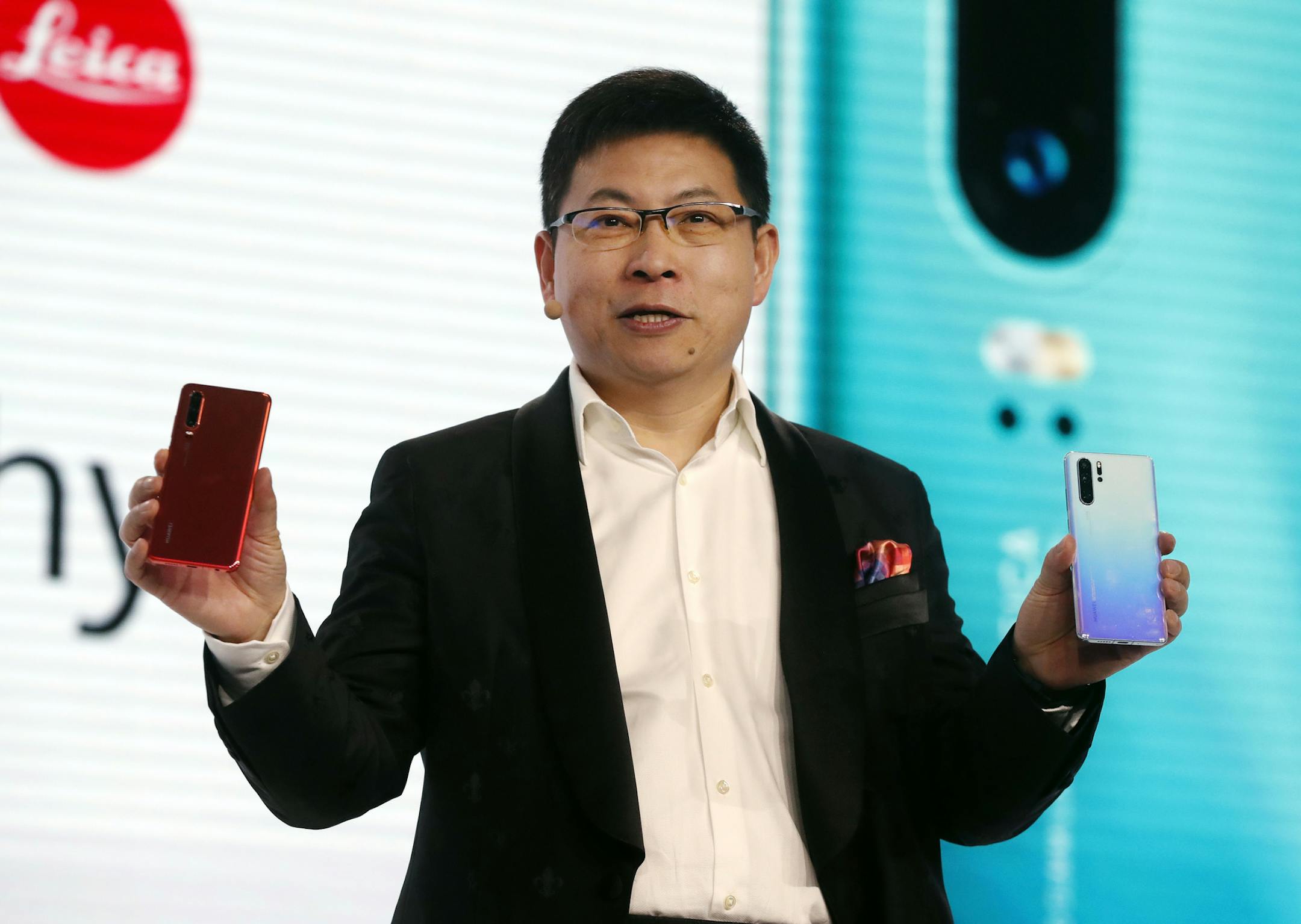 Huawei CEO Richard Yu displays the new Huawei P30 smartphone during a presentation, in Paris, Tuesday, March 26, 2019. (AP Photo/Thibault Camus)