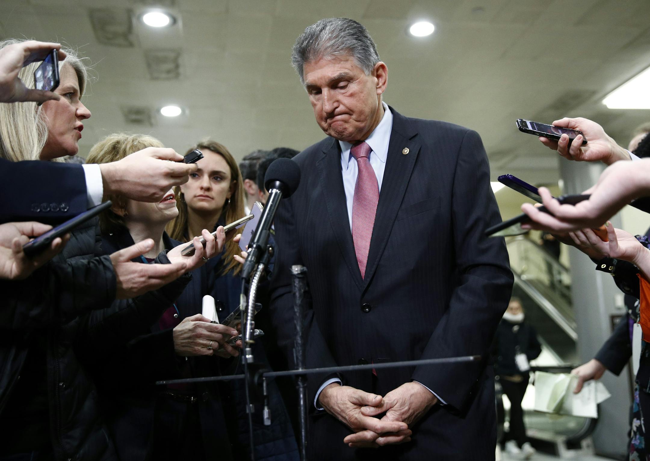 Sen. Joe Manchin, D-W.Va., speaks with reporters after President Donald Trump was acquitted in an impeachment trial on charges of abuse of power and obstruction of Congress on Capitol Hill in Washington, Wednesday, Feb. 5, 2020. (AP Photo/Patrick Semansky)