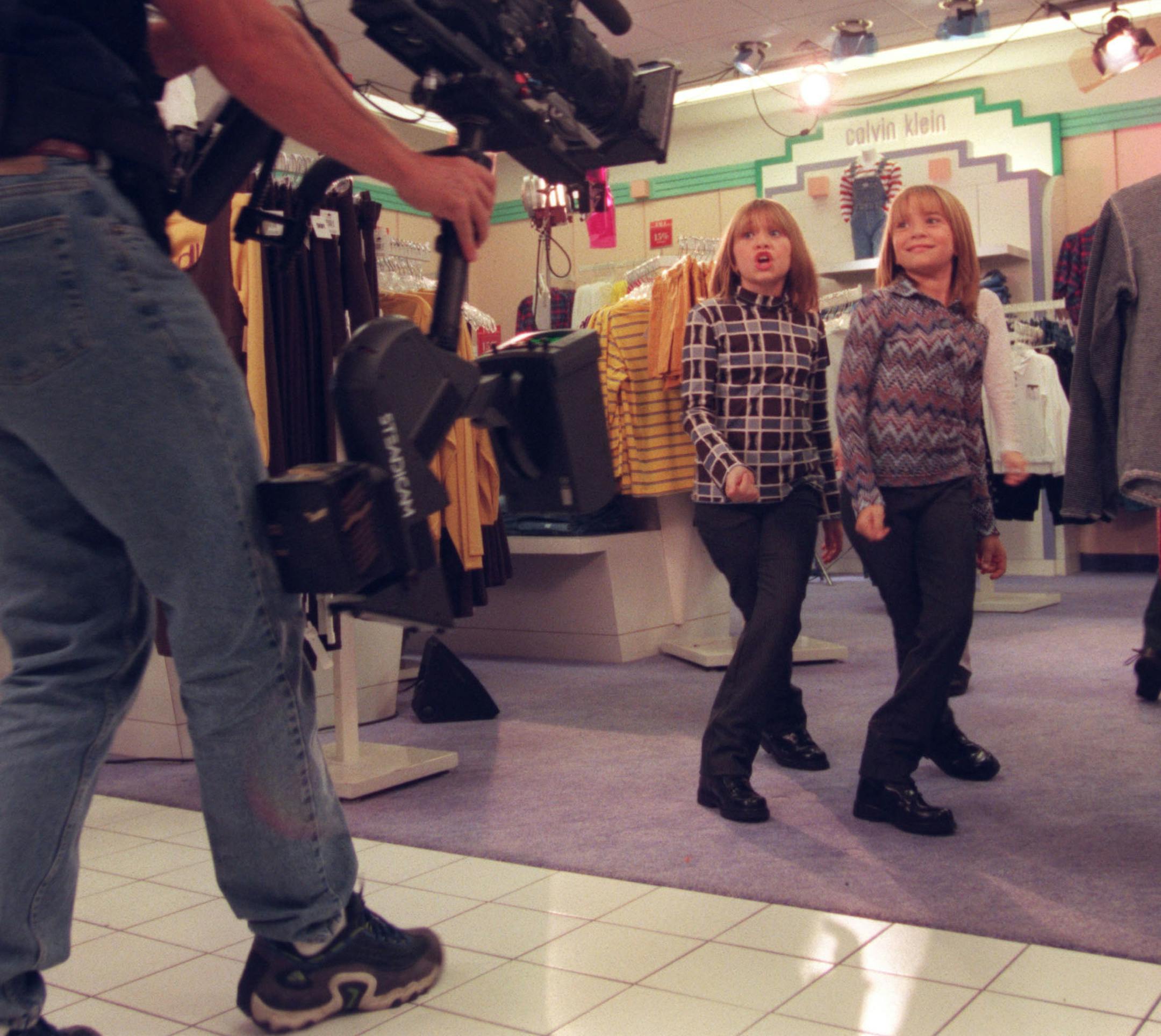 The Olsen twins, the richest kids in show business, are turning the Mall into their own movie set. They're filming a video there this week. We tag along. -- Ashley and Mary-Kate Olsen, left and right, dance and lip sync during the filming of ìYouíre Invited to Mary-Kate & Ashleyís Mall Partyî in Bloomingdaleís at the Mall of America Thursday. The richest kids in show business are turning the mall into their own movie set as they film a video this week.