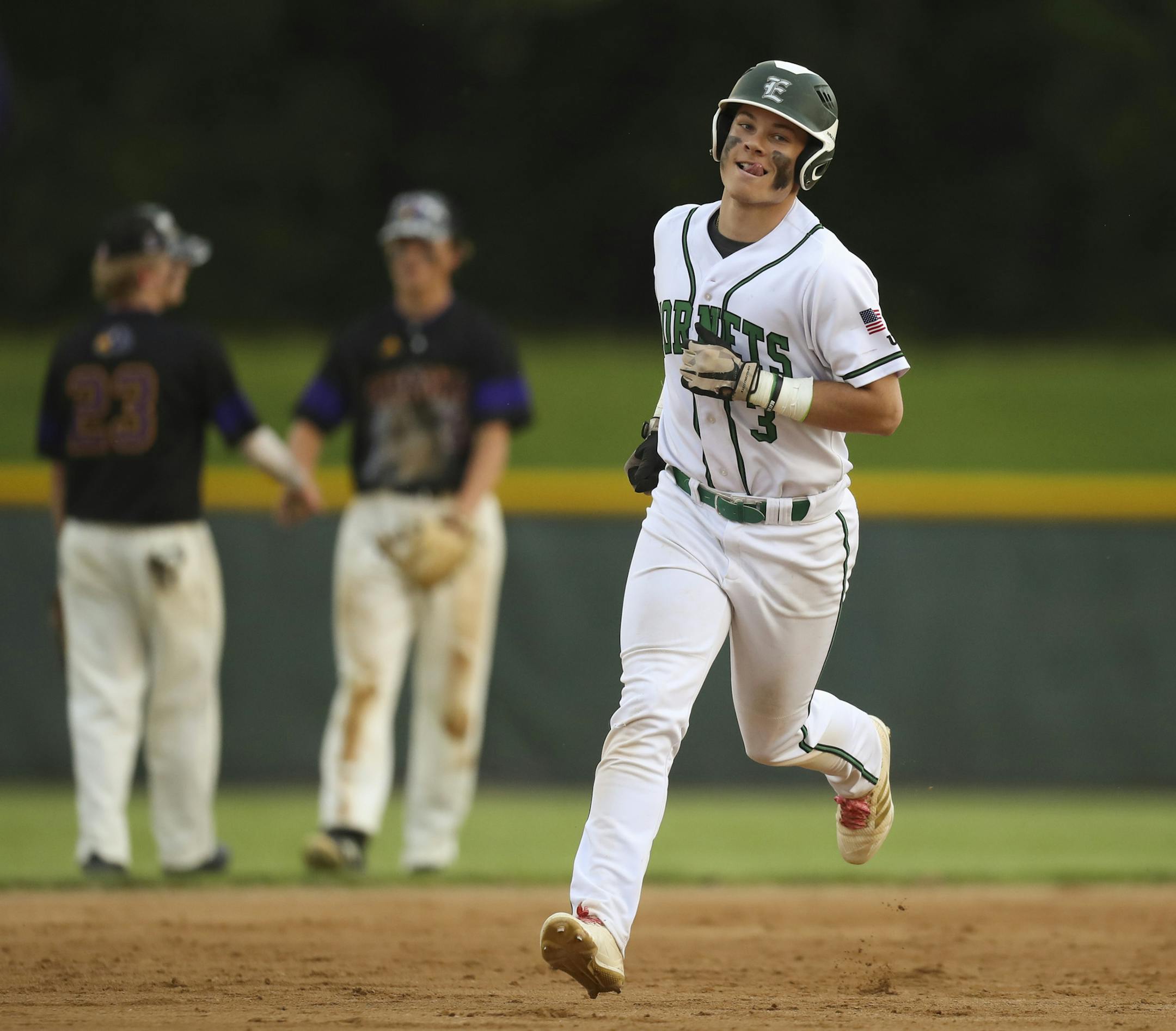 Charlie Fischer rounded the bases after he hit a two run homer against Chaska in their elimination game Monday night in Chaska. ] JEFF WHEELER ï jeff.wheeler@startribune.com Edina played Eden Prairie, then Chaska in the Class 4A, Section 2 playoffs Monday evening at the Chaska Athletic Park. Edina's Charlie Fischer, who has signed to play for Southern Miss, hit homers in both games.