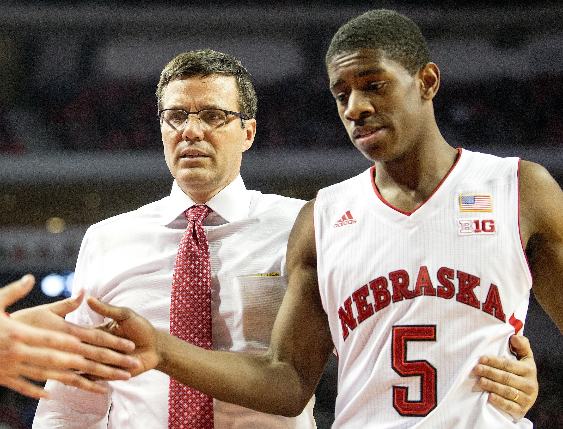 Nebraska head coach Tim Miles escorts guard Glynn Watson Jr. (5) to the bench during the second half of an NCAA college basketball game against Minnesota in Lincoln, Neb., Tuesday, Jan. 12, 2016. (Francis Gardler/The Journal-Star via AP) LOCAL TELEVISION OUT; KOLN-TV OUT; KGIN-TV OUT; KLKN-TV OUT; MANDATORY CREDIT