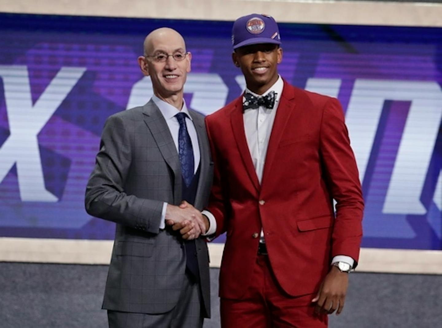 NBA Commissioner Adam Silver poses for photographs with Texas Tech's Jarrett Culver after the Phoenix Suns selected him as the sixth pick overall in the NBA basketball draft Thursday, June 20, 2019, in New York. (AP Photo/Julio Cortez)