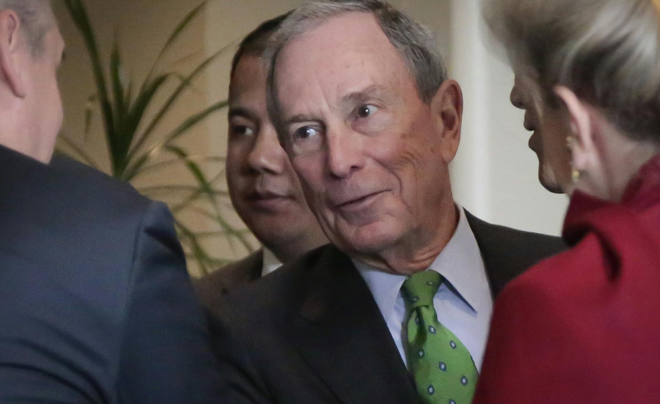 Former New York Mayor and U.N. special envoy for cities and climate change Michael Bloomberg, center, talks with diplomats after attending the biennial "Investor Summit on Climate Risk" on Wednesday, Jan. 27, 2016 at U.N. headquarters. (AP Photo/Bebeto Matthews) ORG XMIT: MIN2016012712380935