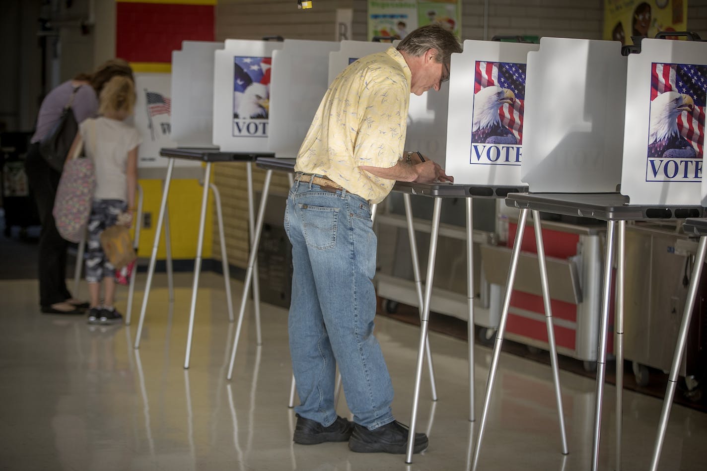 Voters, including Mark Miller, made their way to the Precinct 3 voting site at Mendota Elementary School on primary election day, Tuesday, August 14, 2018 in Mendota Heights, MN.