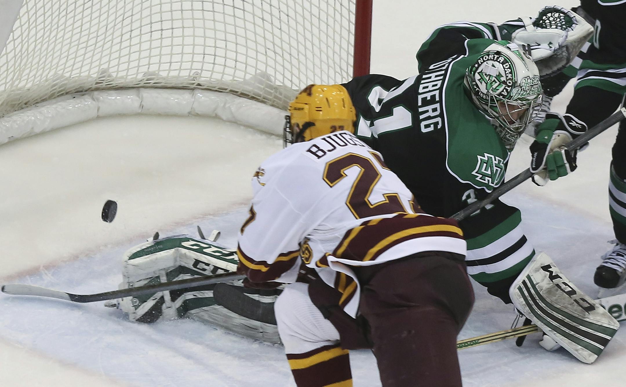 Minnesota's Zach Budish scored on North Dakota's goalie Zane Gothberg during the third period at Mariucci Arena in Minneapolis, Min., Saturday January 19, 2013. The game ends in a tie in overtime 4-4.