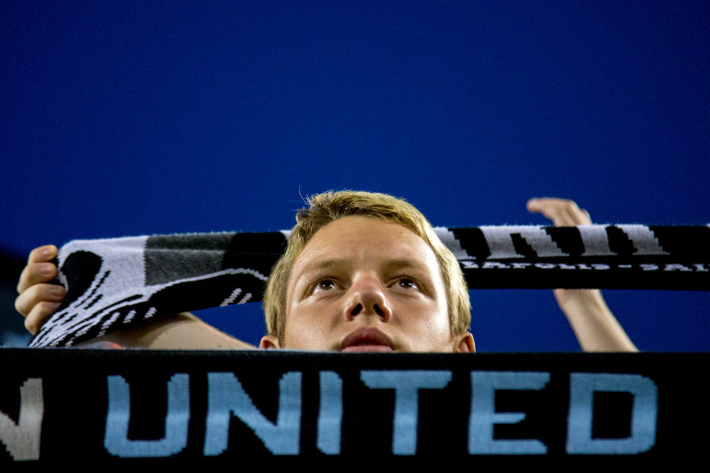 Boden Nystrom, 16, holds up a Minnesota United scarf after the team's 4-0 against D.C. United in an MLS soccer match Saturday, July 29, 2017, in Minneapolis. (Courtney Pedroza/Star Tribune via AP)