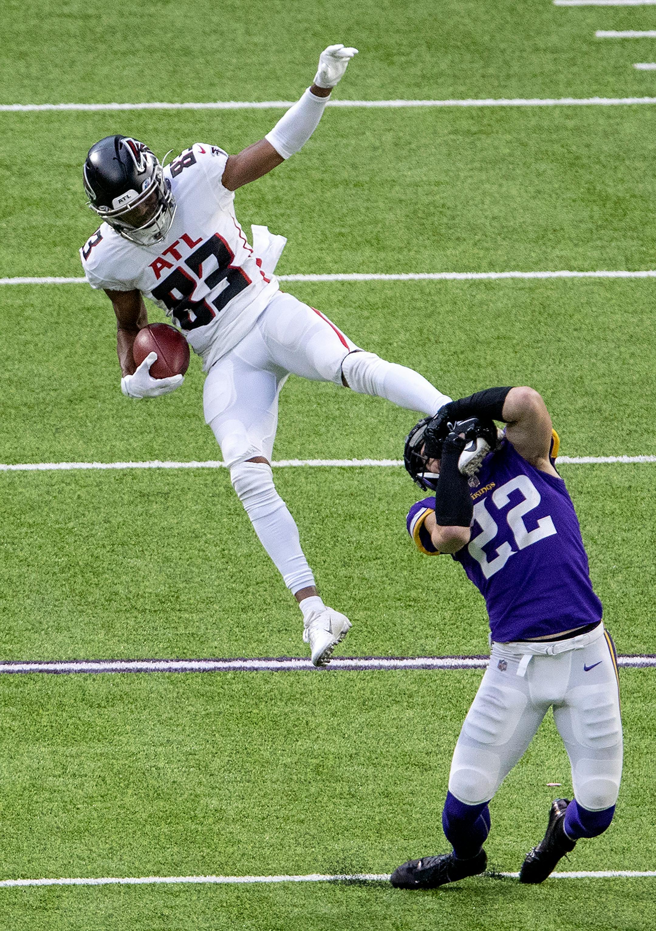 Atlanta Falcons receiver Russell Gage (83) was tackled by Minnesota Vikings safety Harrison Smith (22) in the second quarter.