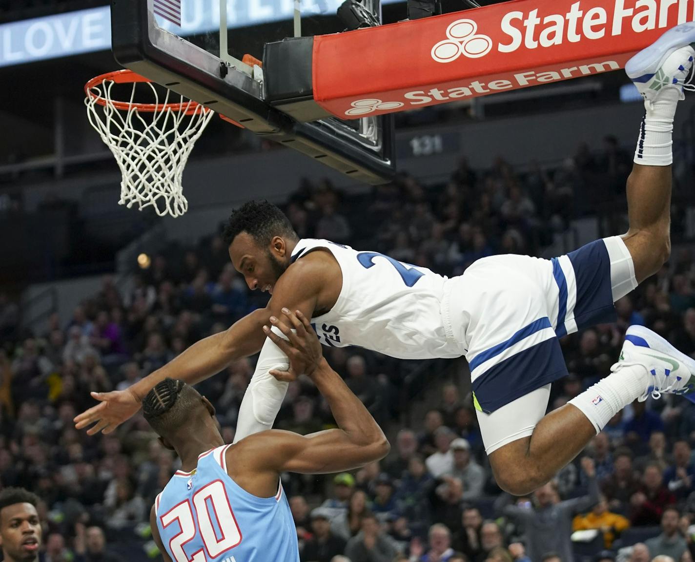 Minnesota Timberwolves guard Josh Okogie (20) made a spectacular descent from the hoop after dunking in the second quarter on Sacramento Kings forward Harry Giles (20). ] JEFF WHEELER &#xef; jeff.wheeler@startribune.com The Minnesota Timberwolves faced the Sacramento Kings in an NBA basketball game Monday night, December 17, 2018 at Target Center in Minneapolis.