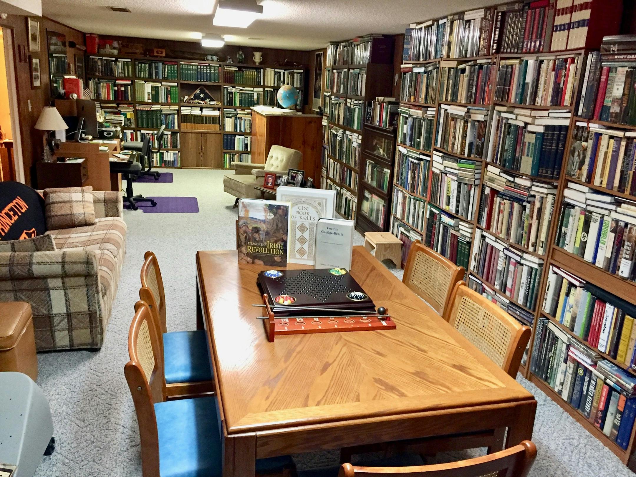 The highly organized basement library of Tadhg Mac an Bháird of Anoka.