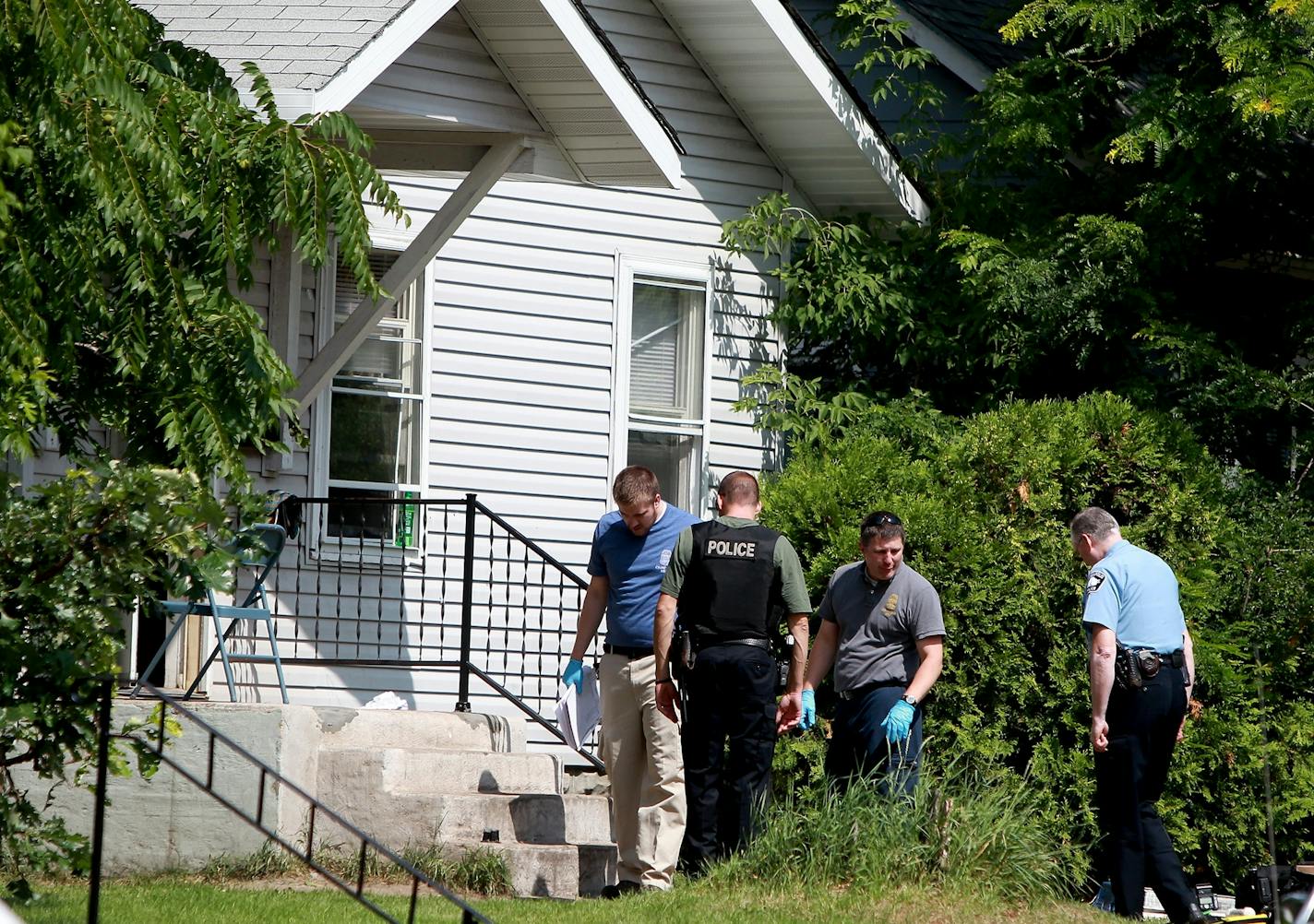 Minneapolis police looked over the scene where an early morning shooting claimed the life of a 5-year-old on the 4500 block of Bryant Avenue North.