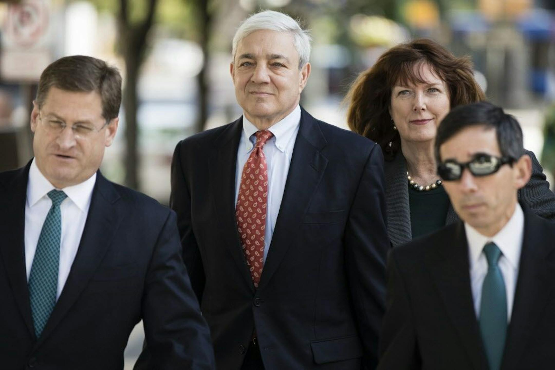 Former Penn State President Graham Spanier, center, arrives for his sentencing hearing at the Dauphin County Courthouse in Harrisburg, Pa., Friday, June 2, 2017.