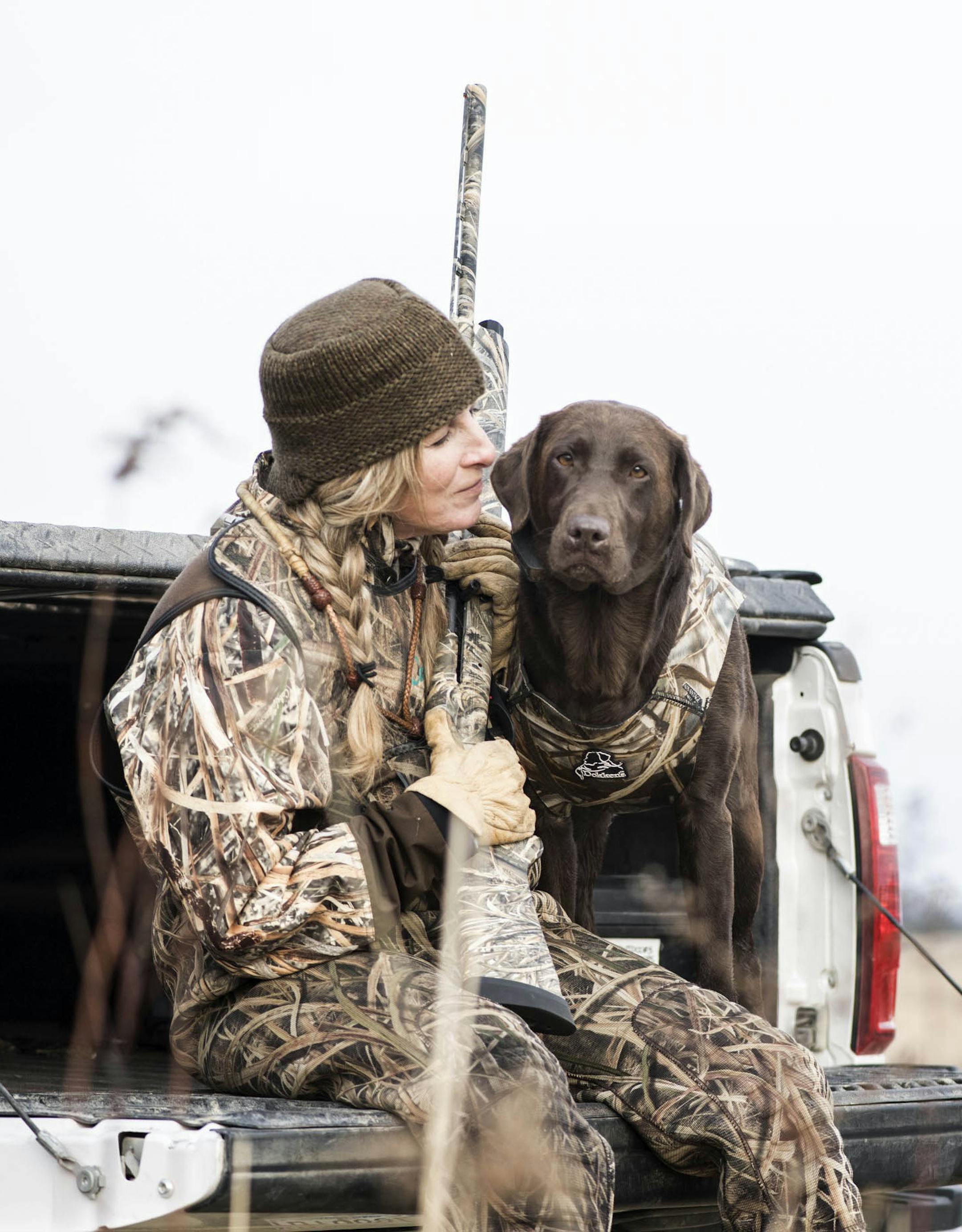 Tina Dokken with her Labrador retriever, Sassy.