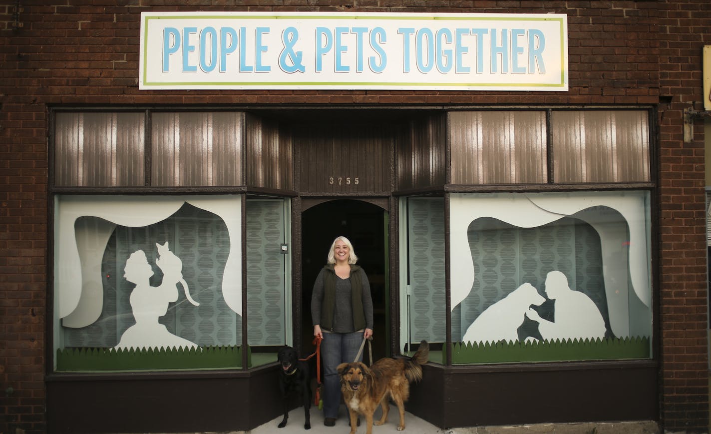 Kim Carrier with her two dogs, Rosie and Stella, at People & Pets Together, which will be the state's first dedicated food shelf for pets when it opens, she hopes, by the end of the year. ] JEFF WHEELER &#xef; jeff.wheeler@startribune.com In the height of the Great Recession, Kim Carrier and a band of dedicated volunteers started stocking food shelves with pet food, with the idea that that hungry people shouldn't have to choose between feeding themselves and feeding their pets. Her organization