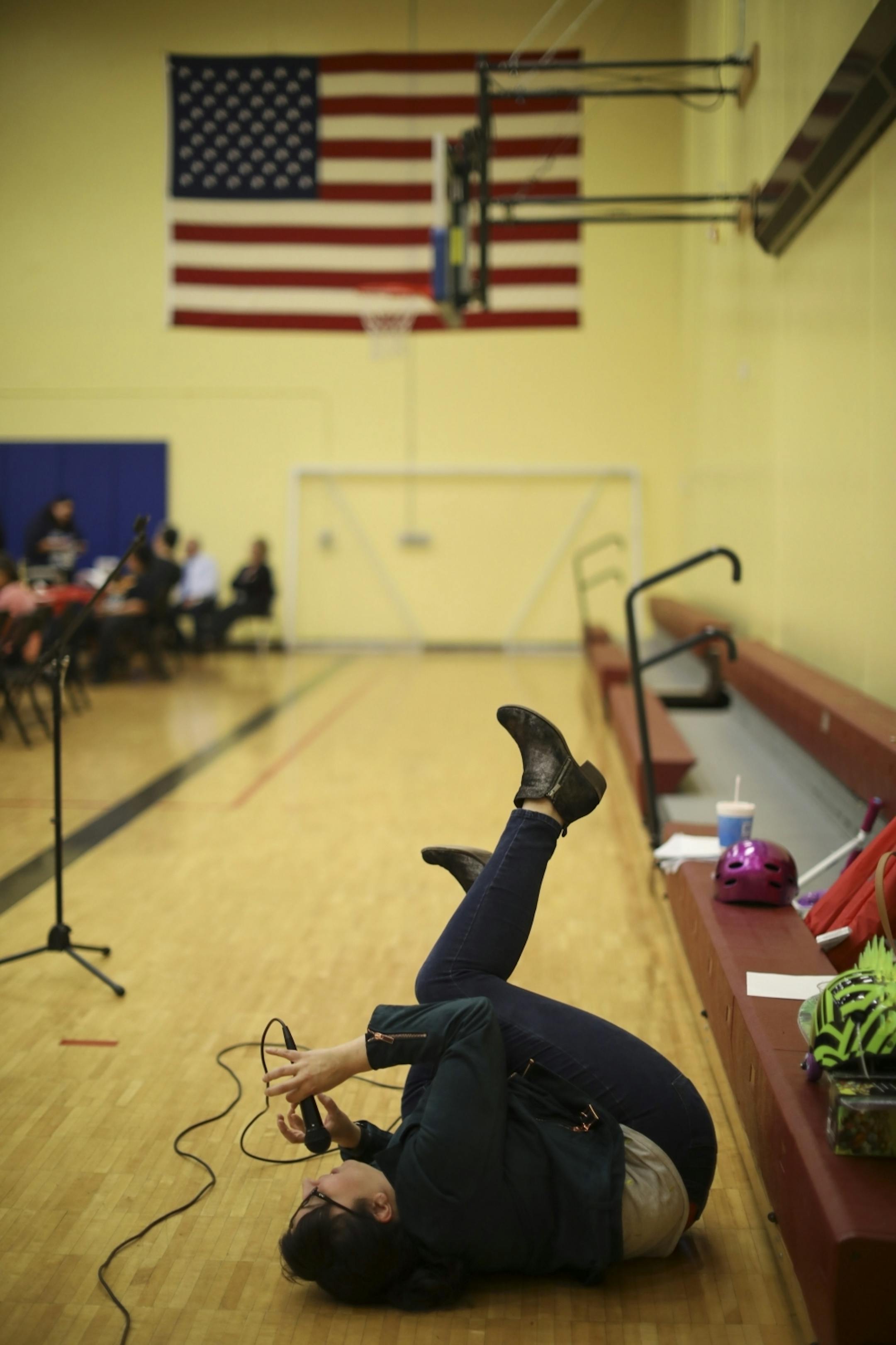 Marisa Carr rolled on the floor after one of the kids shared a joke with the audience as they ate dinner. Carr was the event's emcee.